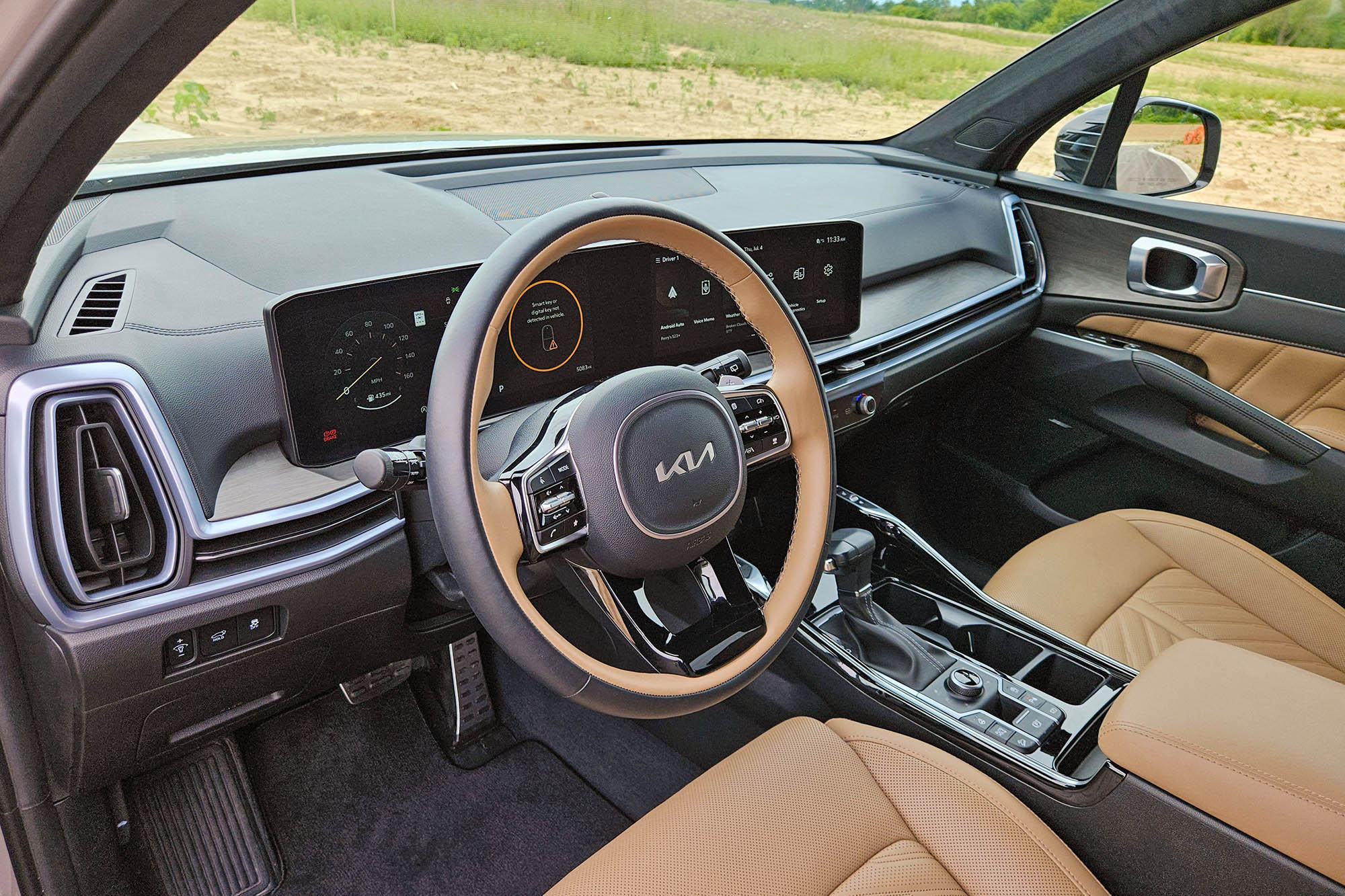 View of a 2024 Kia Sorento SX Prestige X-Pro interior showing the dashboard and Olive Brown front seats.