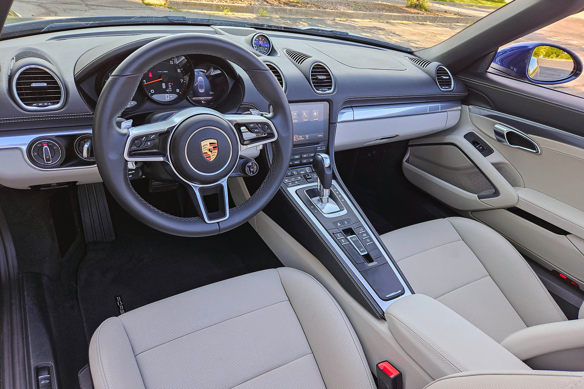 View of a 2024 Porsche 718 Boxster Style Edition interior showing the dashboard and center console