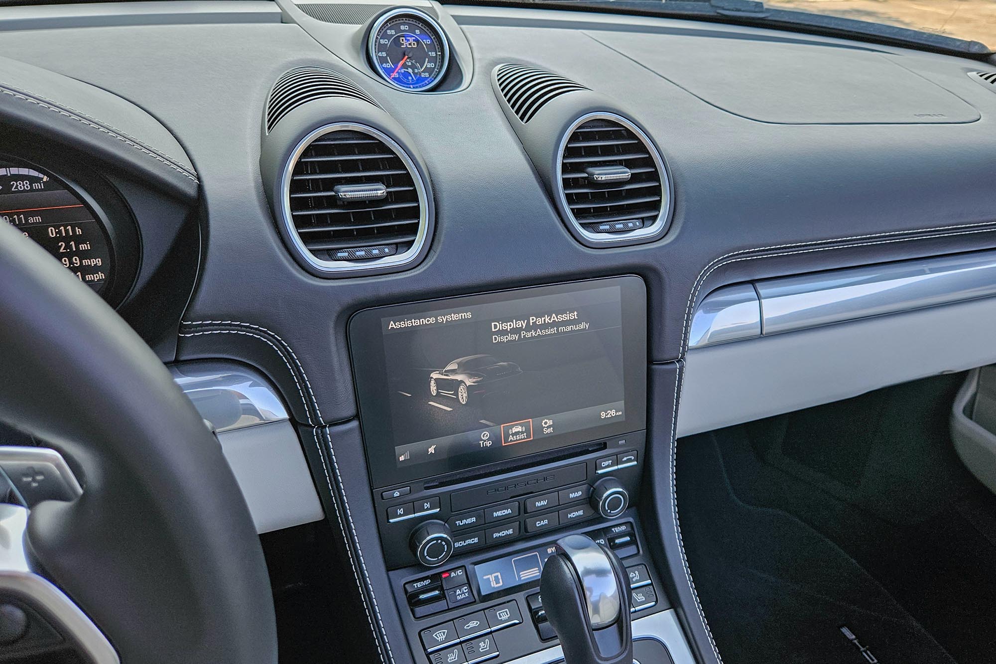 View of a 2024 Porsche 718 Boxster Style Edition interior showing the safety features on the infotainment system screen