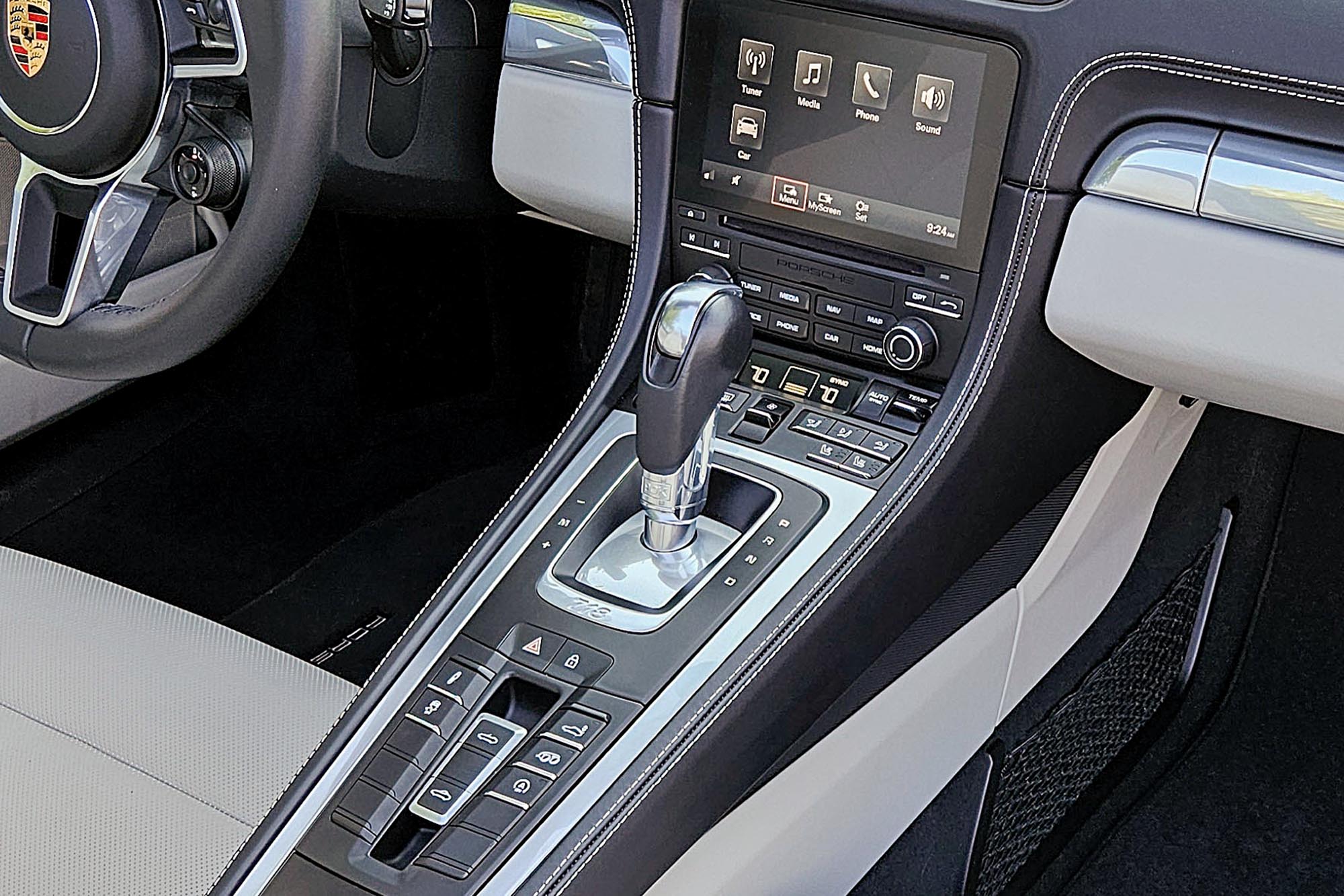 View of a 2024 Porsche 718 Boxster Style Edition interior showing the transmission lever and center console