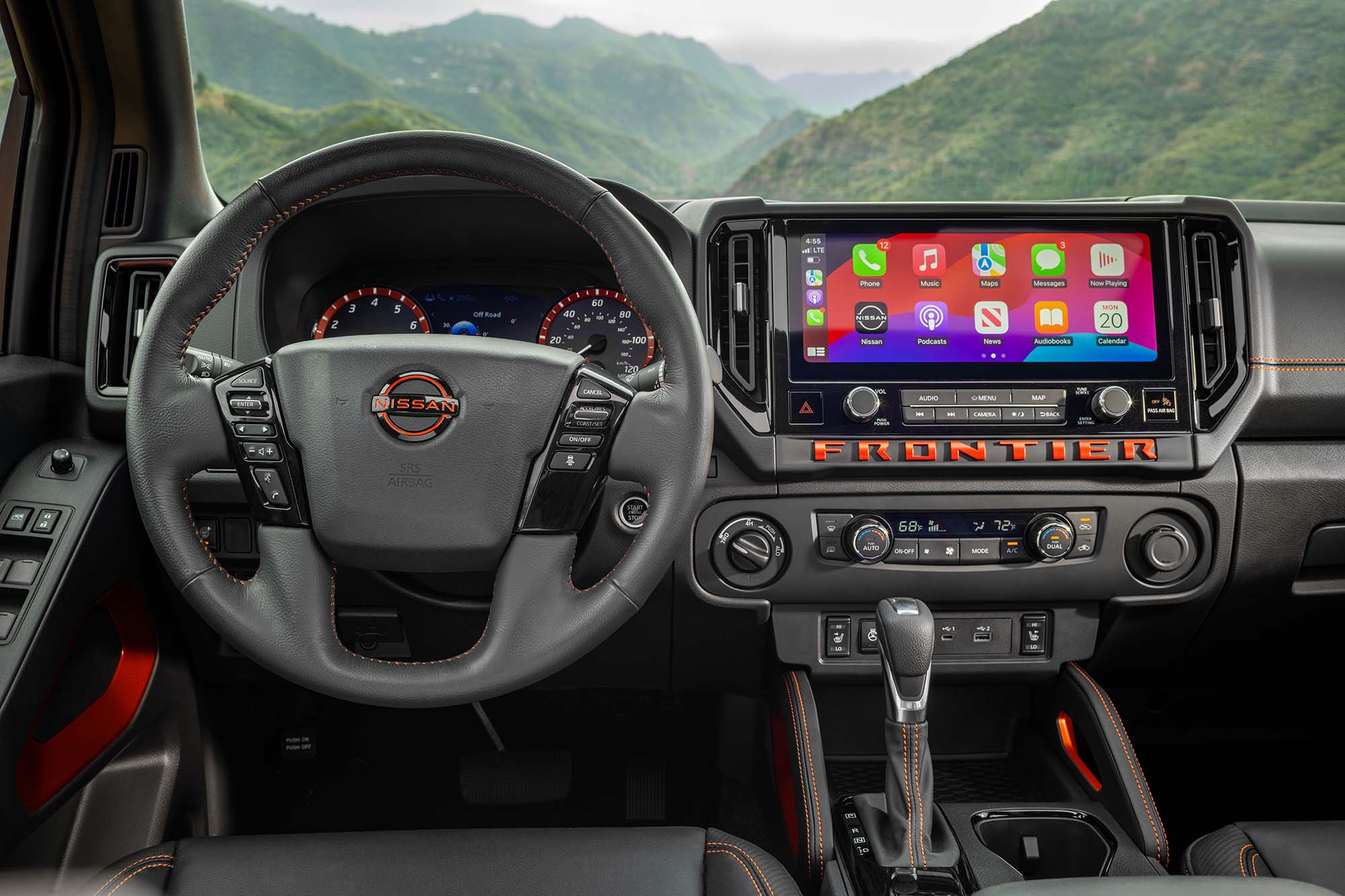 The steering wheel and dashboard of a 2025 Nissan Frontier