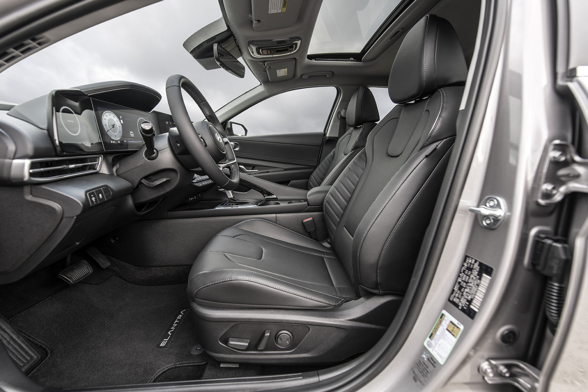 Front interior seating in a gray Hyundai Elantra Hybrid.