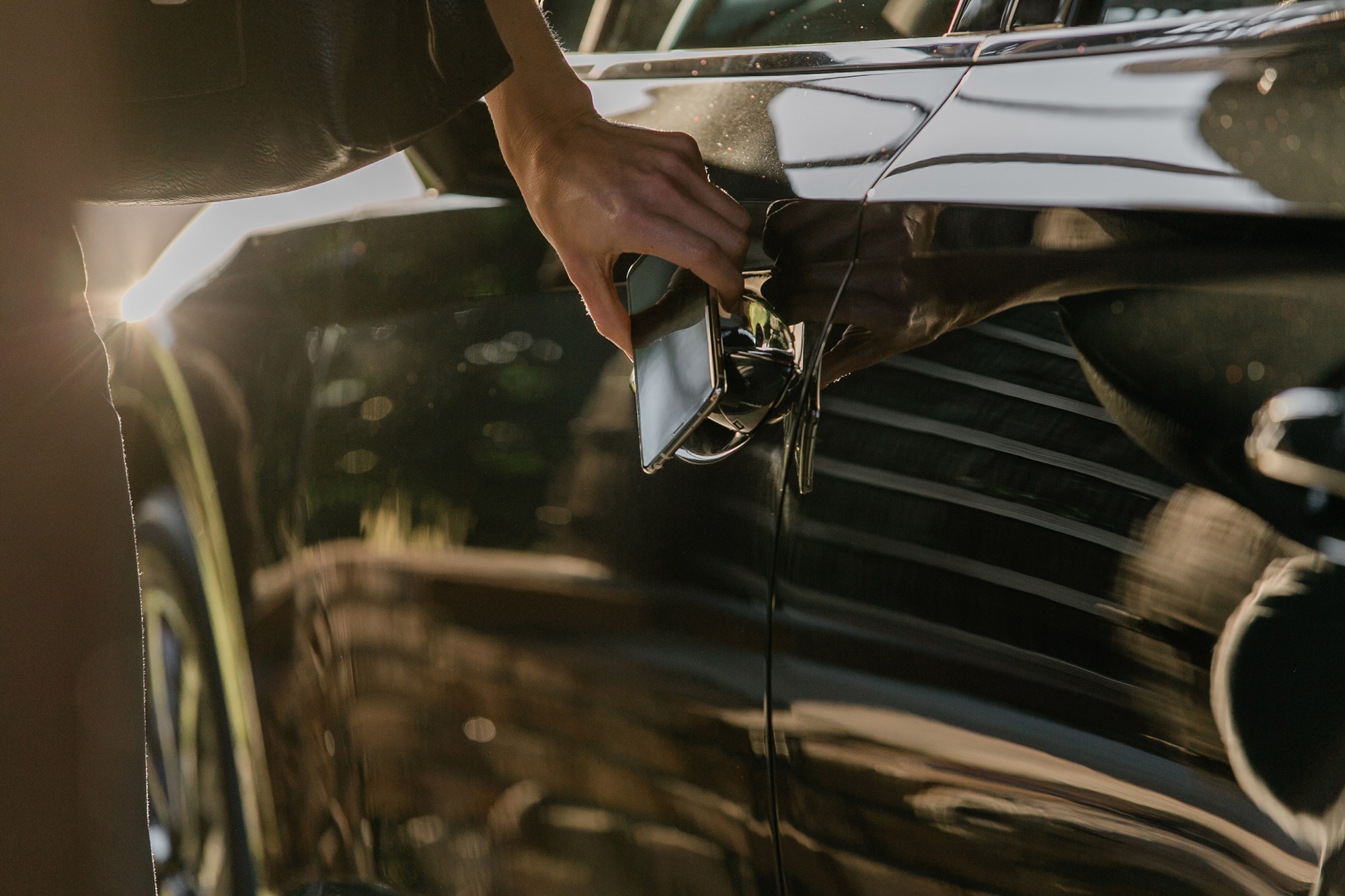 Black car being unlocked by Hyundai digital key