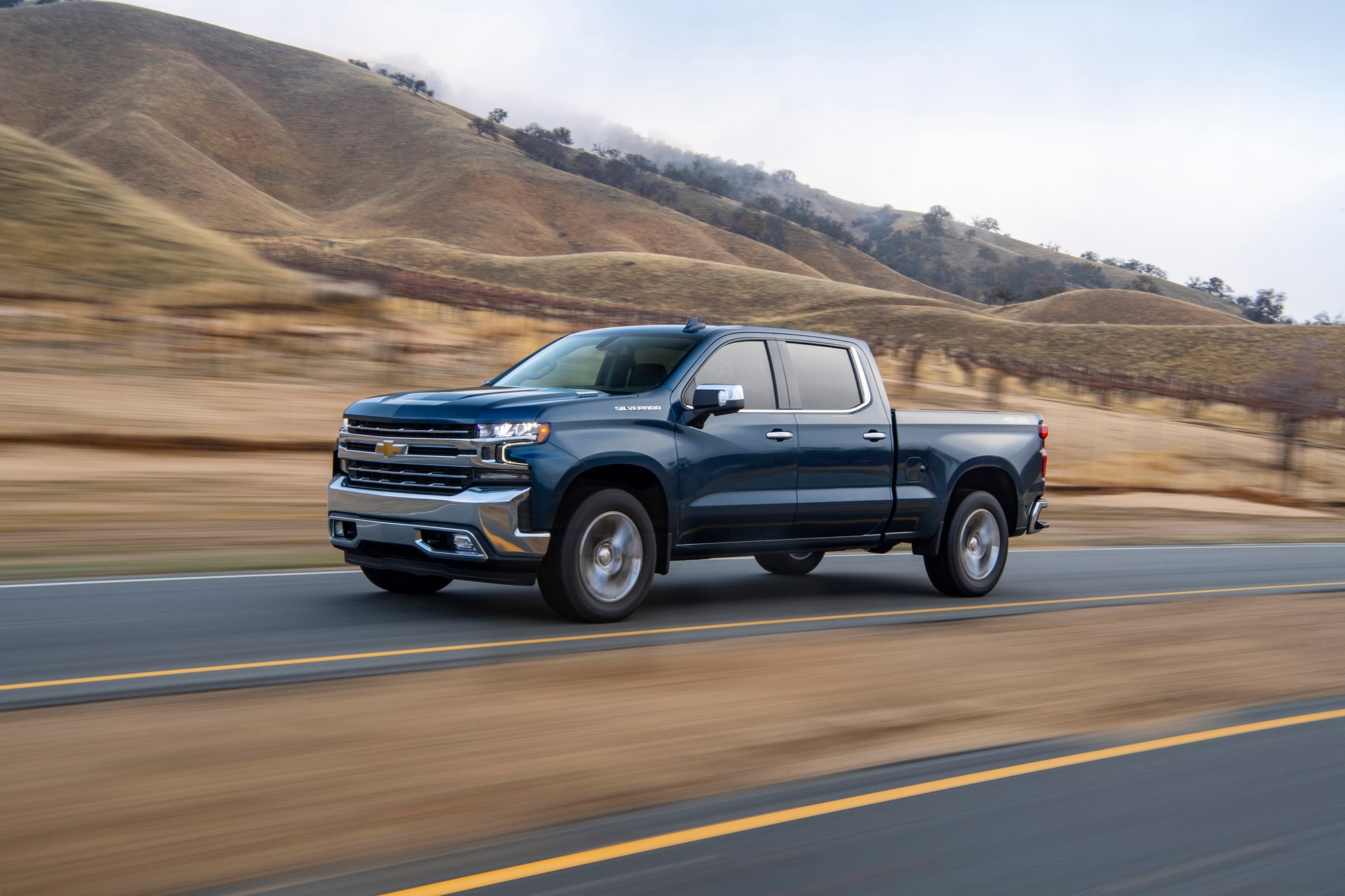 2020 Chevrolet Silverado 1500 with diesel engine driving down a highway.