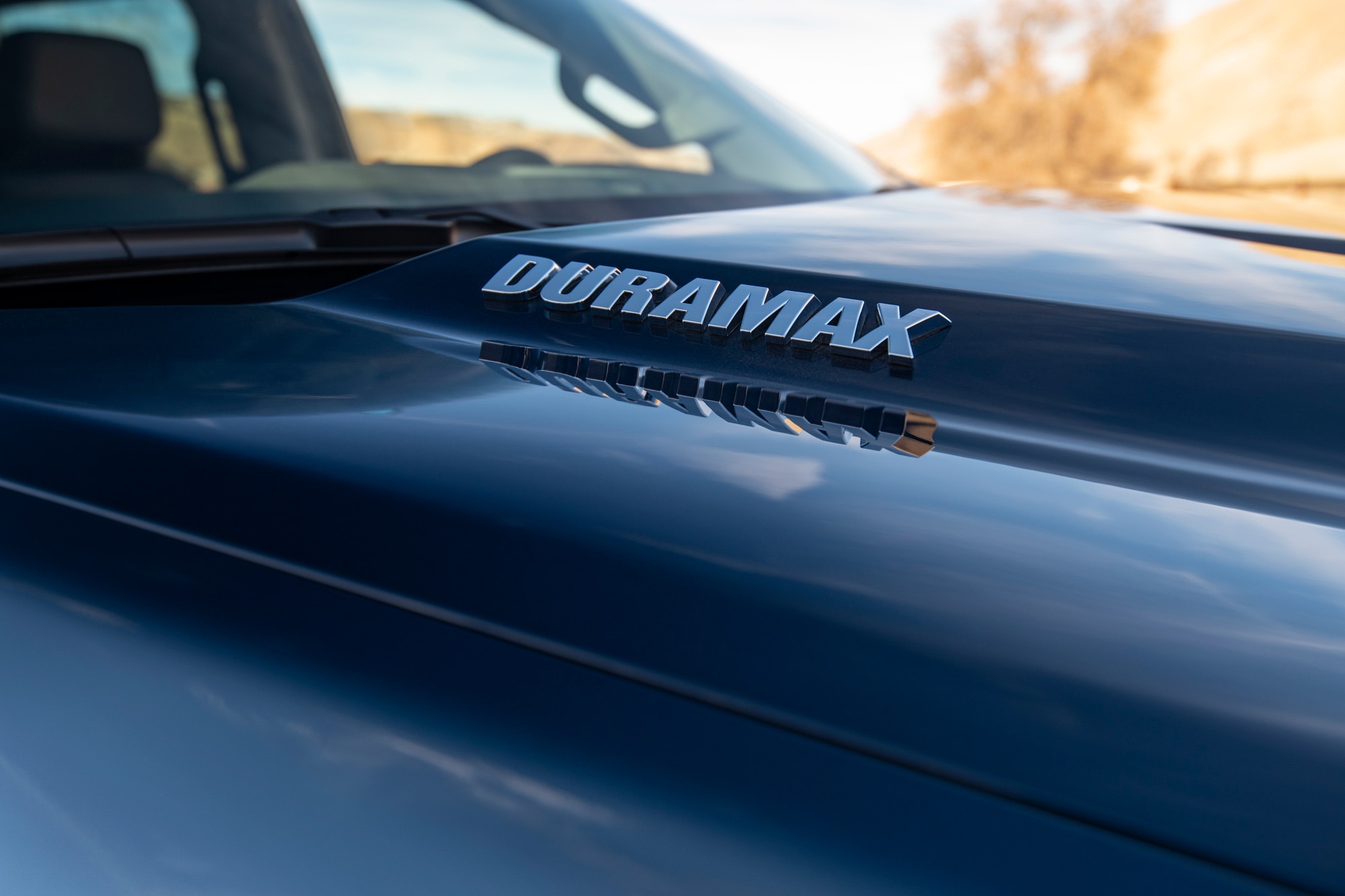 Close up of Chevrolet Silverado 1500 Duramax logo on hood.