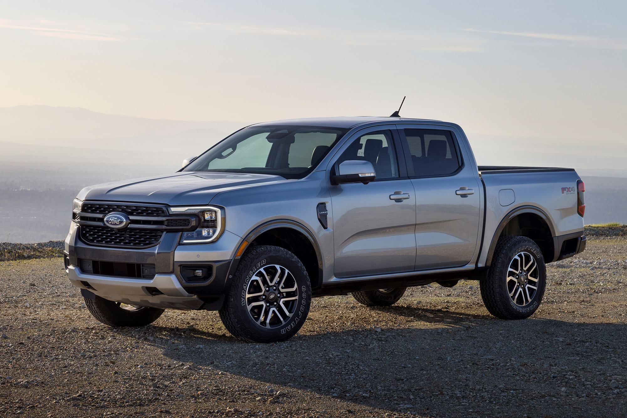 Silver Ford Ranger parked on a mountain overlook.