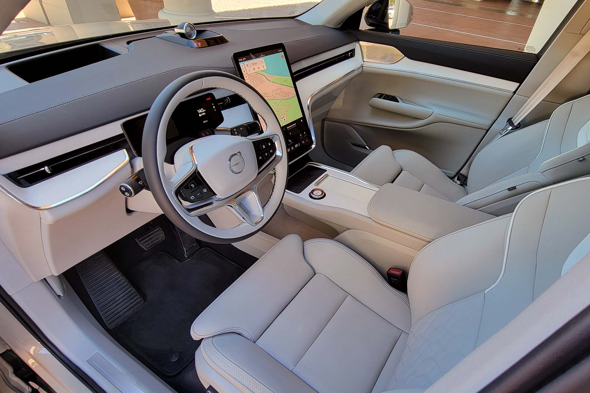 2025 Volvo EX90 Ultra interior showing the dashboard, front seats, and center console.