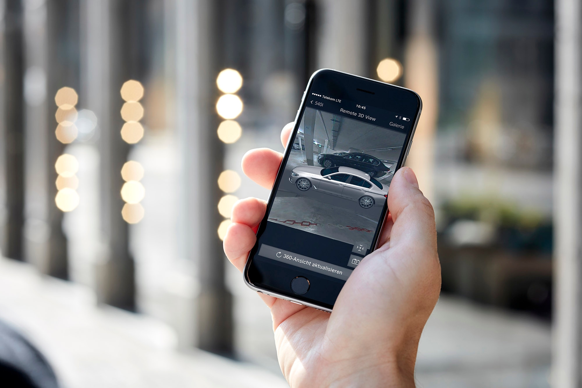 A person using BMW's Remote 3D View on their smartphone