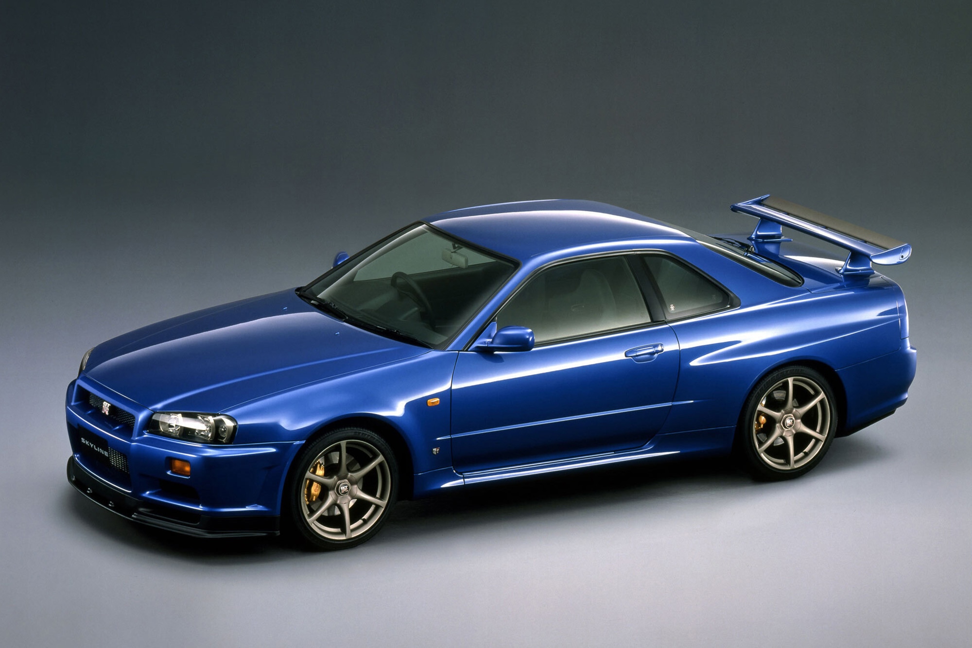 1999 Nissan Skyline GT-R V Spec in dark blue.