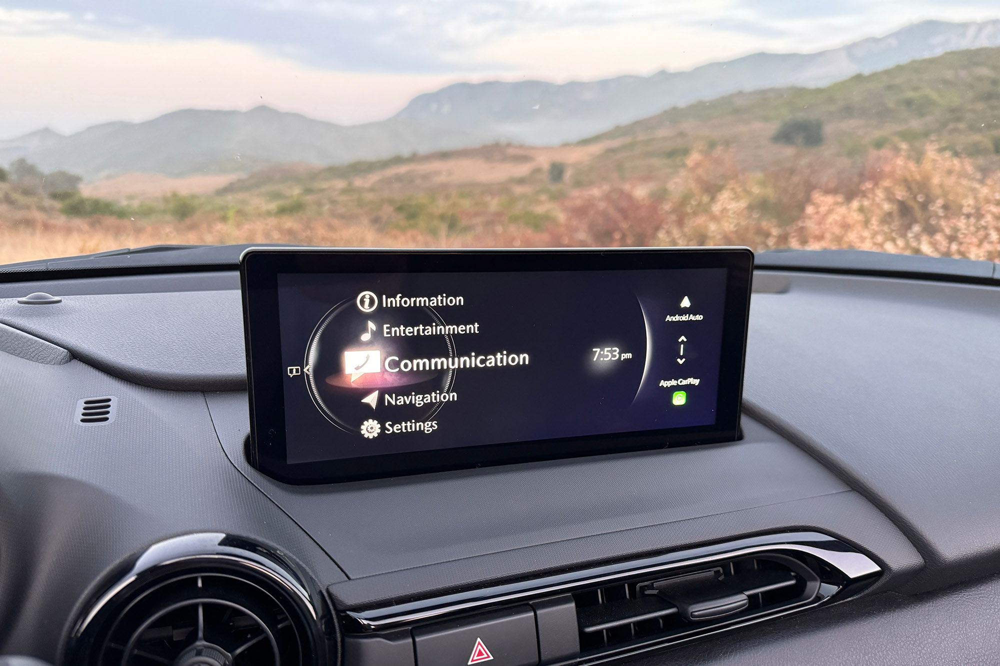 View of a 2024 Mazda MX-5 Miata RF Club interior showing the new 8.8-inch Mazda Connect infotainment system with wireless Apple CarPlay and Android Auto.