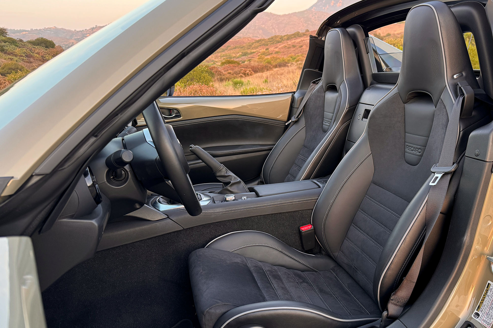 View of a 2024 Mazda MX-5 Miata RF Club interior showing the Recaro performance seats.