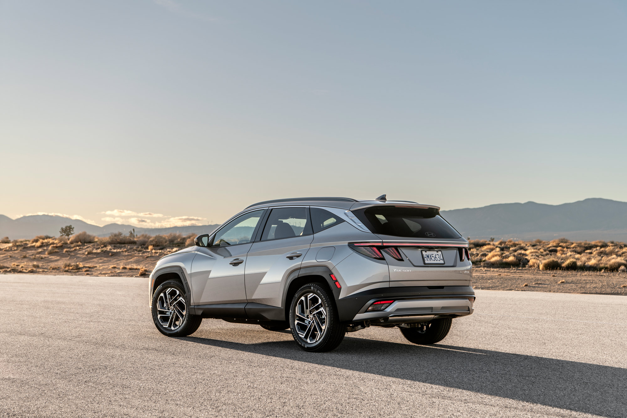 2025 Hyundai Tucson Plug-In Hybrid parked on road in the desert.