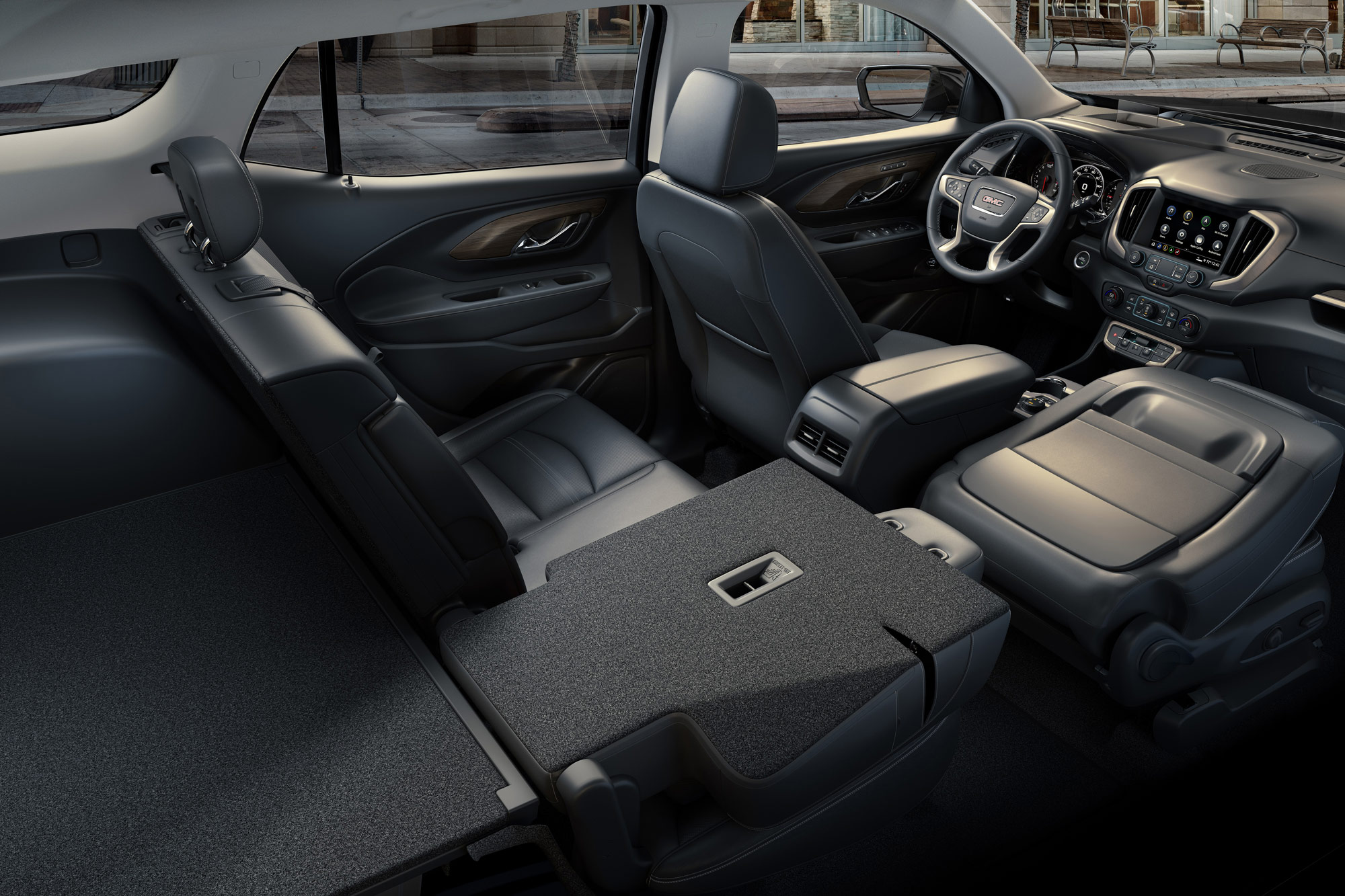 Cutaway view of 2024 GMC Terrain interior with one rear seat and passenger front seat folded flat.