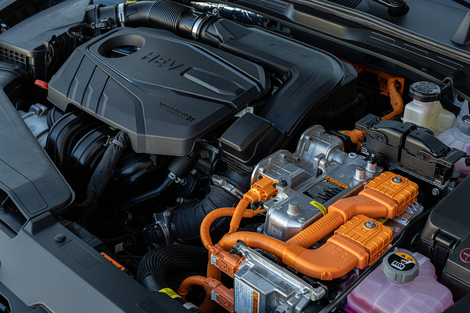 Under-hood view of a Hyundai Sonata hybrid vehicle.