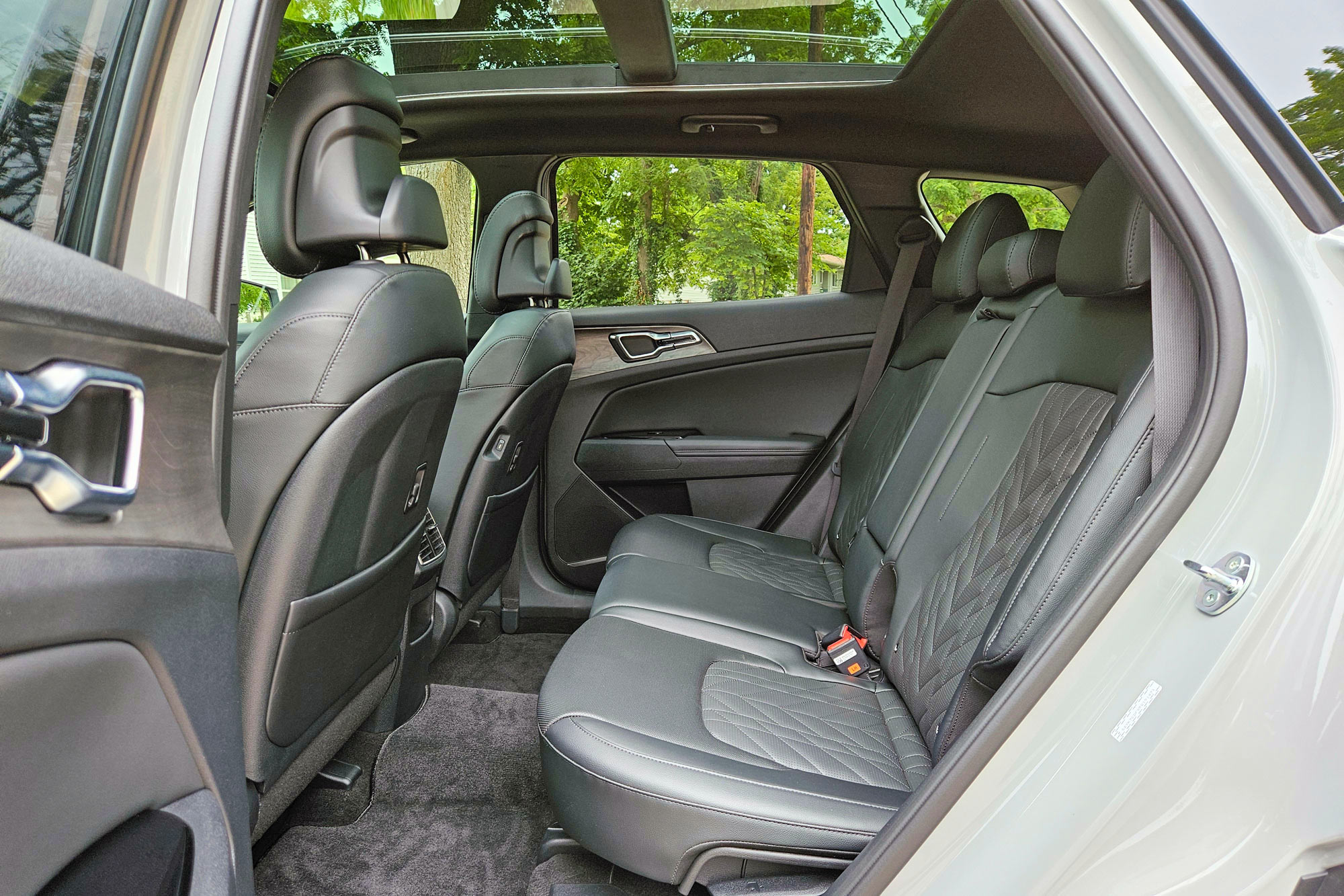 2024 Kia Sportage X-Pro Prestige interior showing the back seat and panoramic sunroof