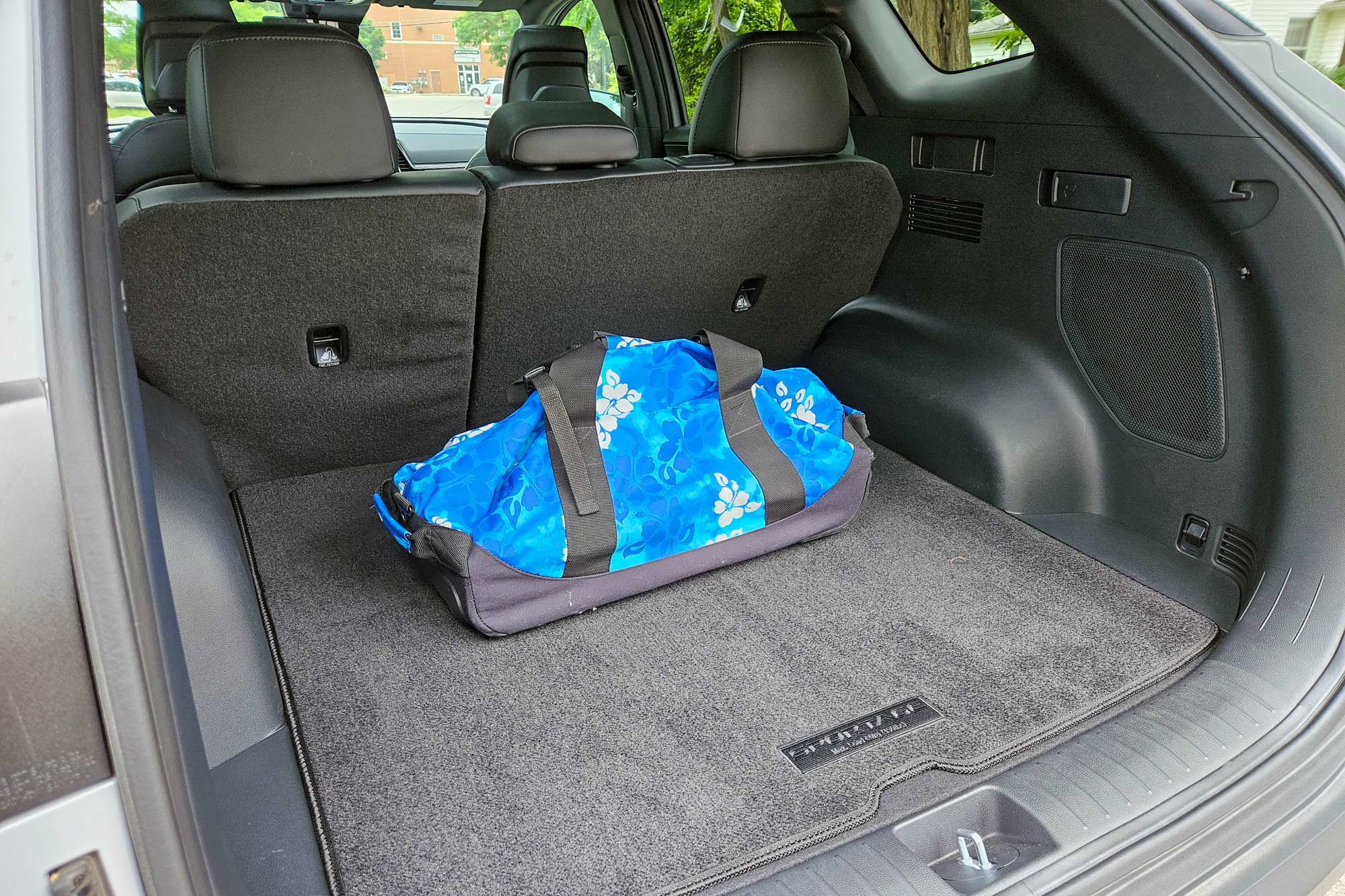 View of the cargo space in a 2024 Kia Sportage X-Pro Prestige interior