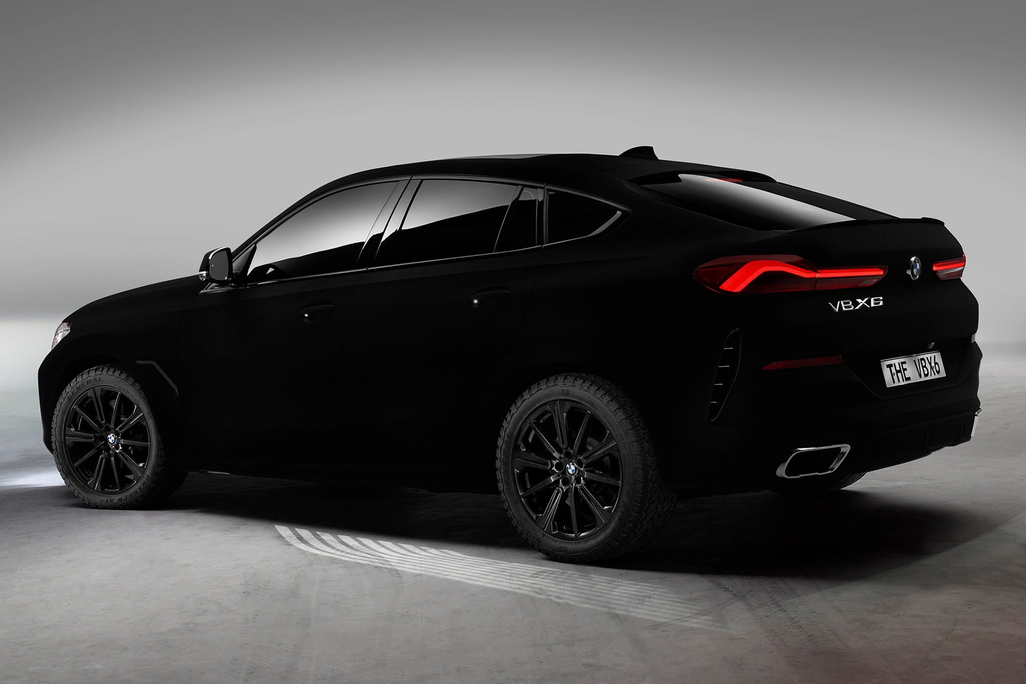 A rear-left view of a 2020 BMW X6 coated in Vantablack