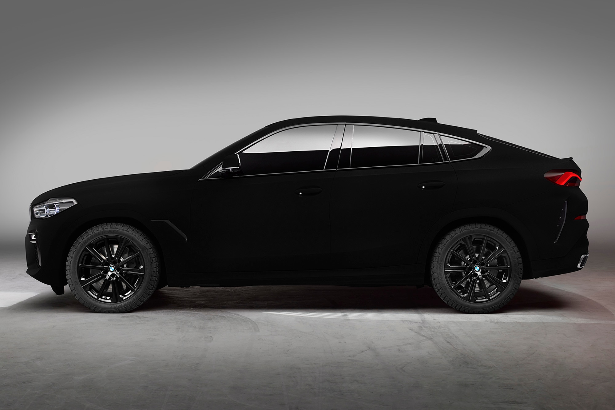 A side view of a 2020 BMW X6 coated in Vantablack