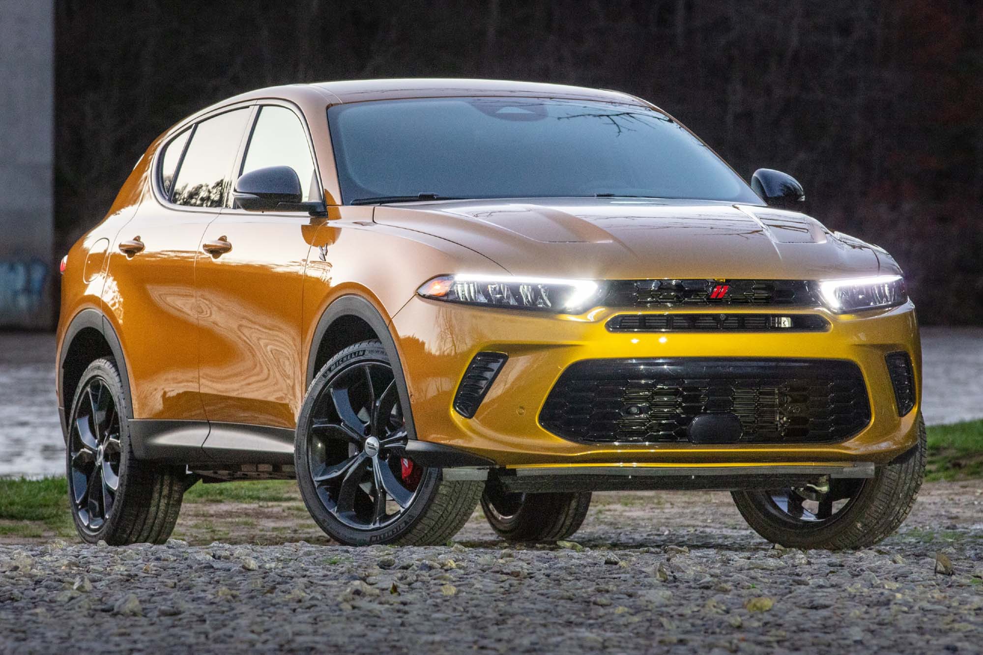 A right-front view of a yellow 2023 Dodge Hornet