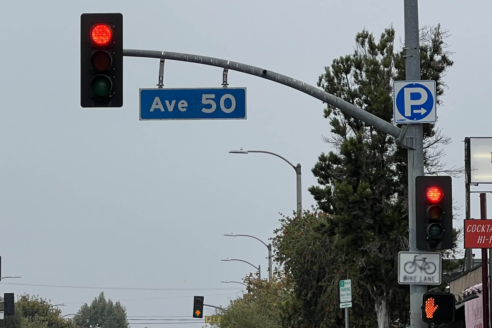 A set of traffic lights and road signs