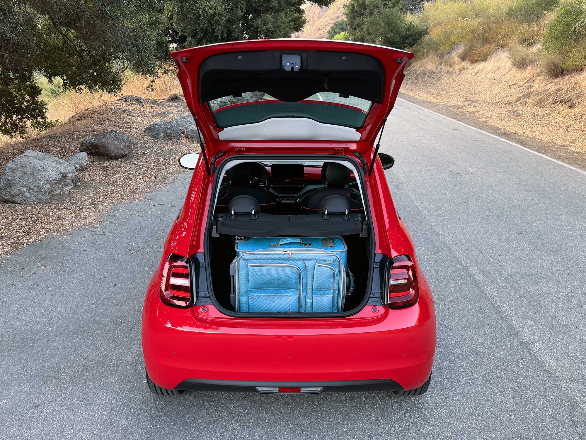 2024 Fiat 500e cargo area with full-size suitcase inside