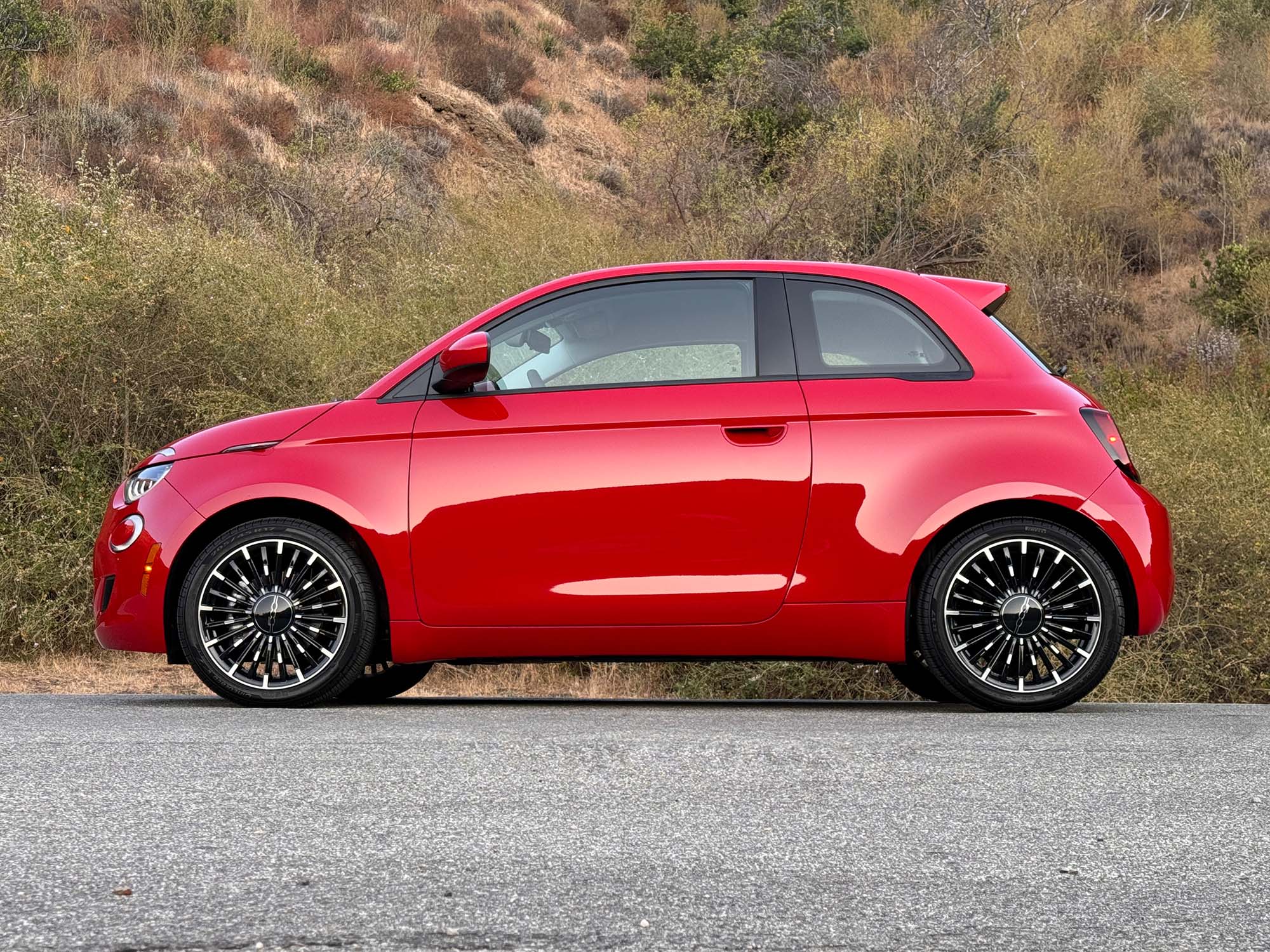 2024 Fiat 500e in red, side view