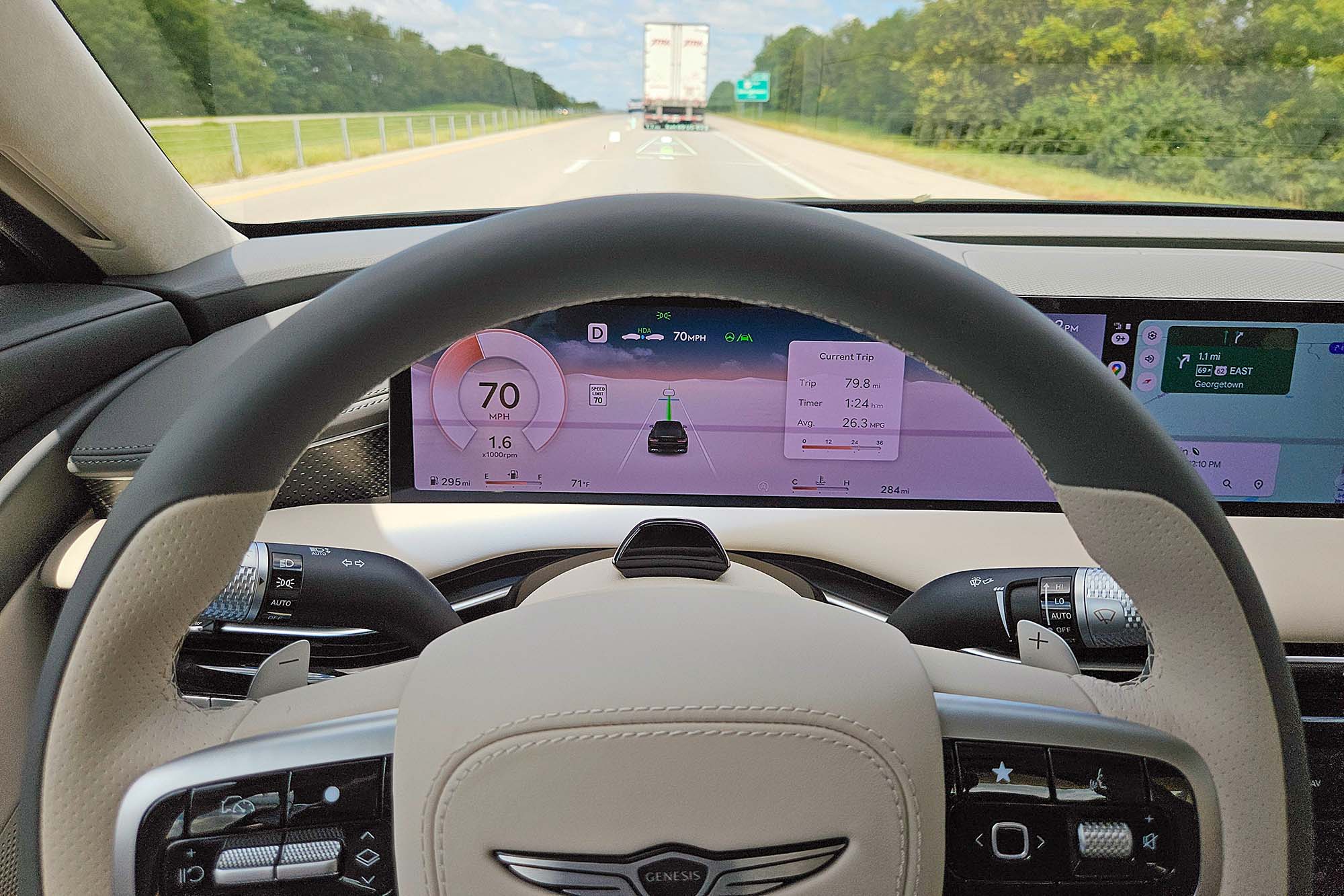 2025 Genesis G80 3.5T Sport Prestige interior showing Highway Driving Assist II active on Interstate 75 in Kentucky