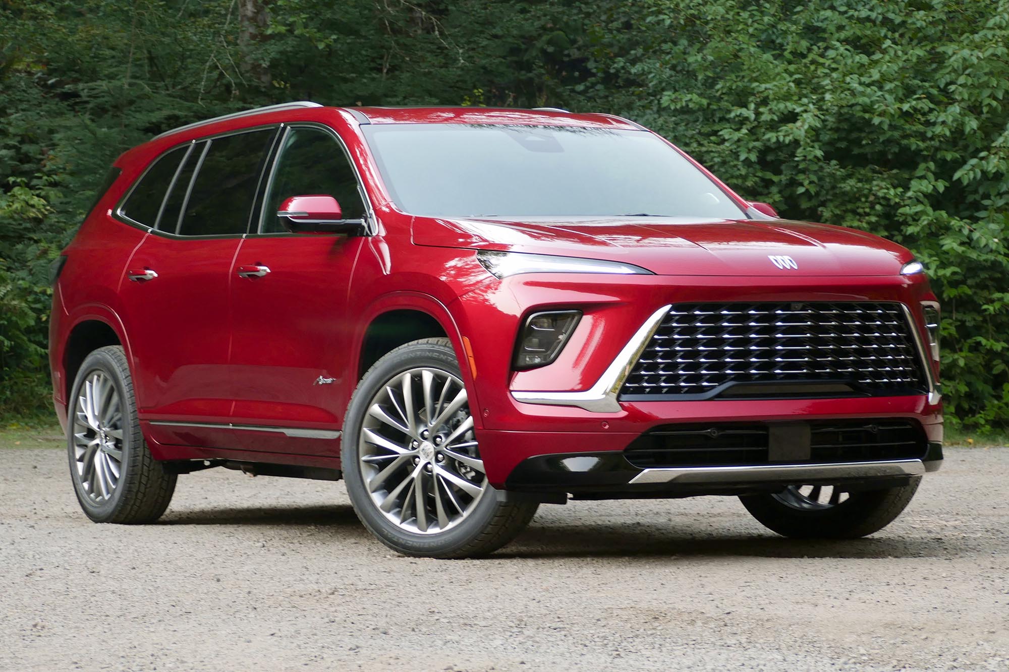 Front-right view of the 2025 Buick Enclave Avenir in Cherry Red