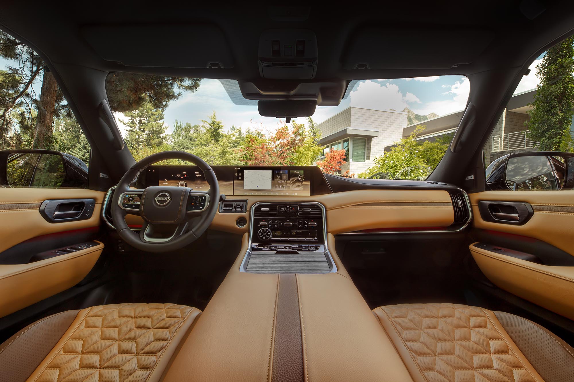 The front seats and dash of a 2025 Nissan Armada.