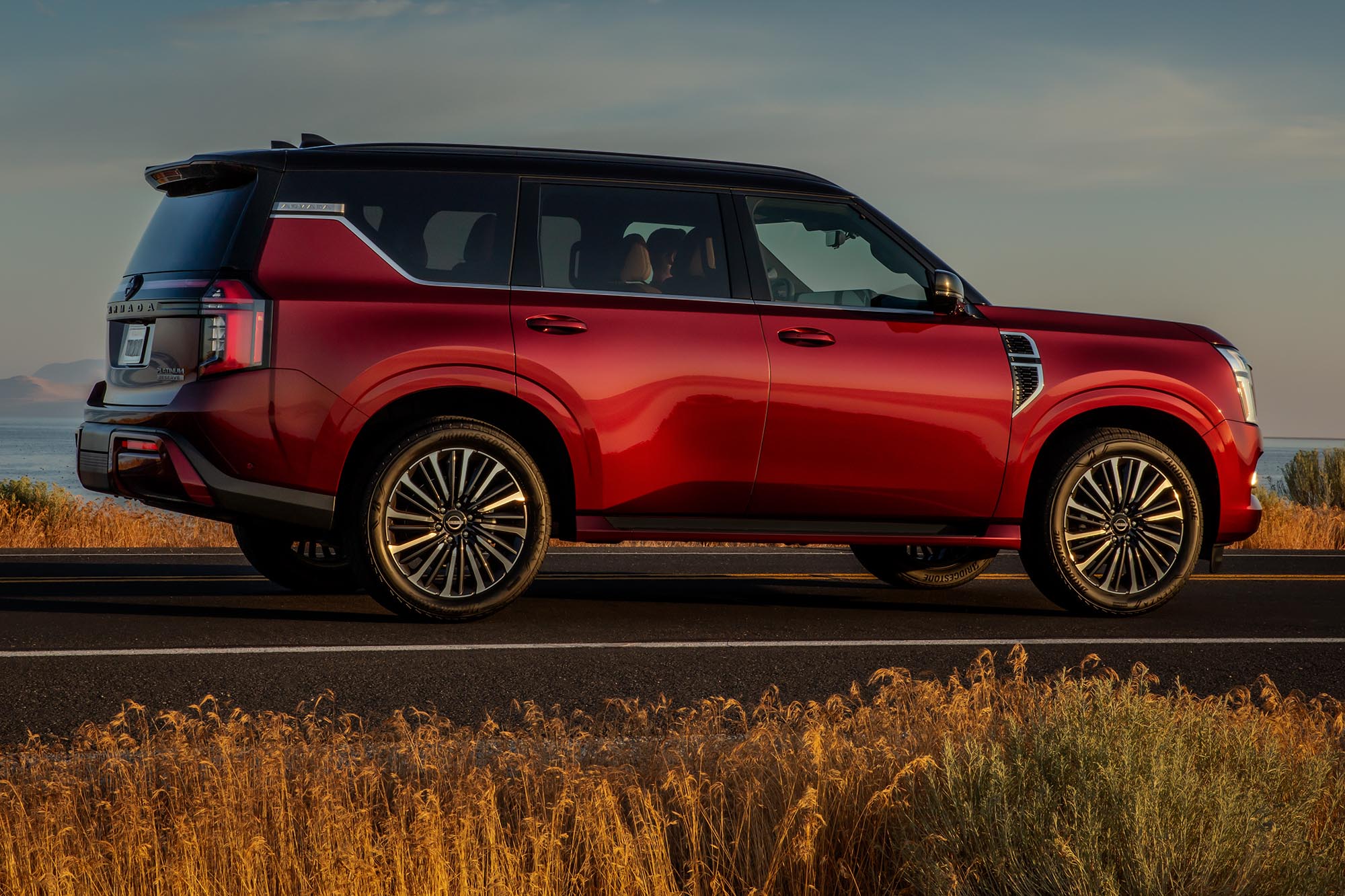 Side view of a red 2025 Nissan Armada.