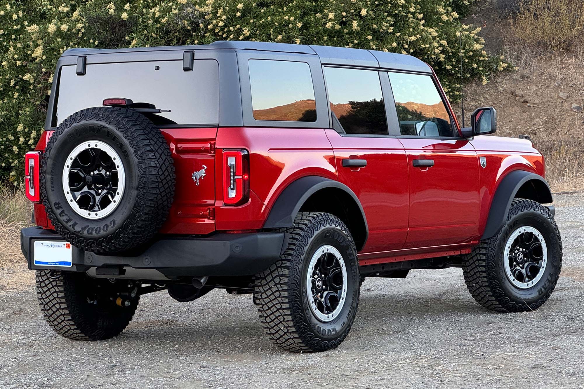 Rear-quarter view of a red 2024 Ford Bronco Big Bend four-door