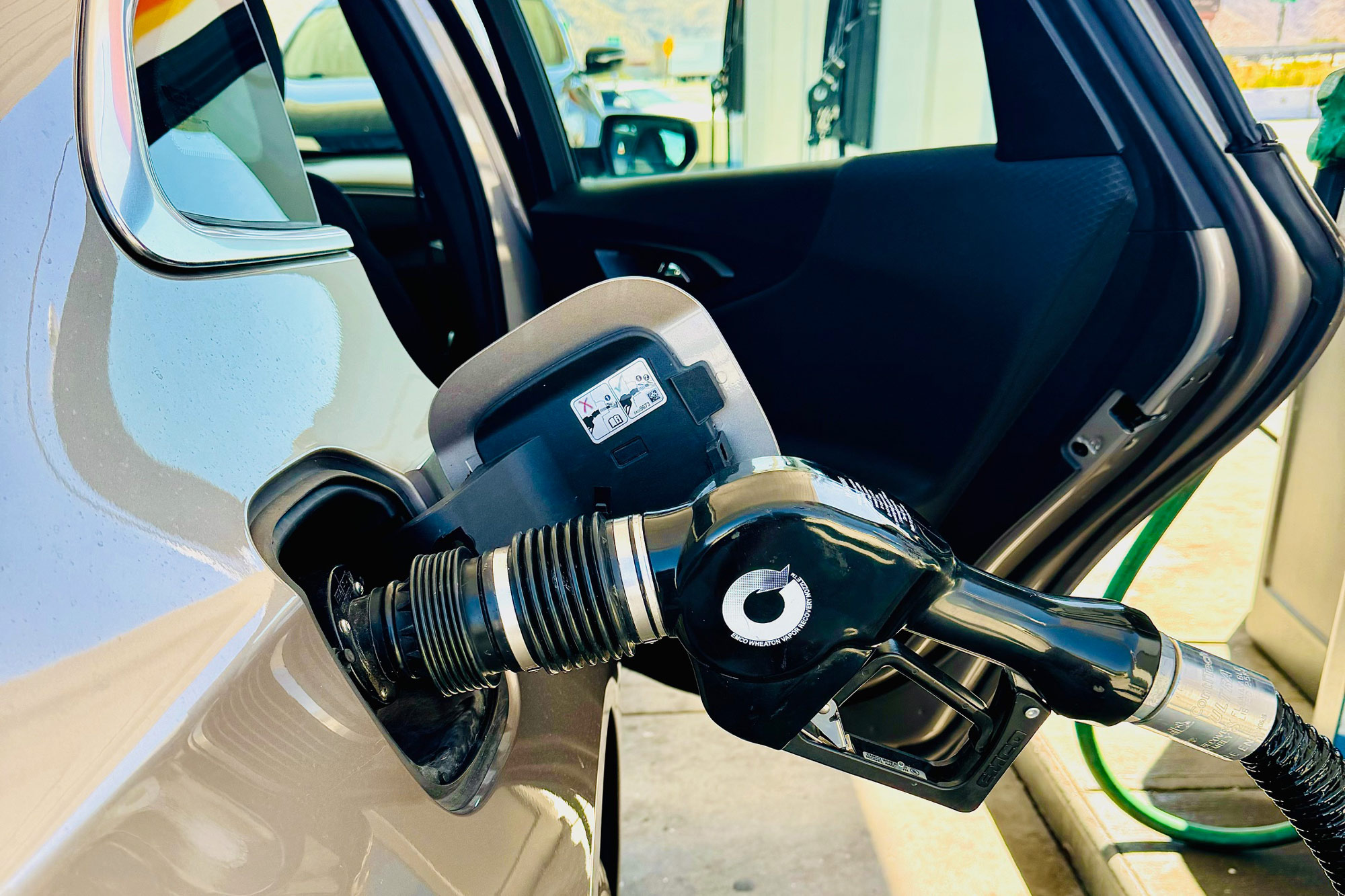 Fueling through a capless fuel filler on a silver 2024 Chevrolet Malibu