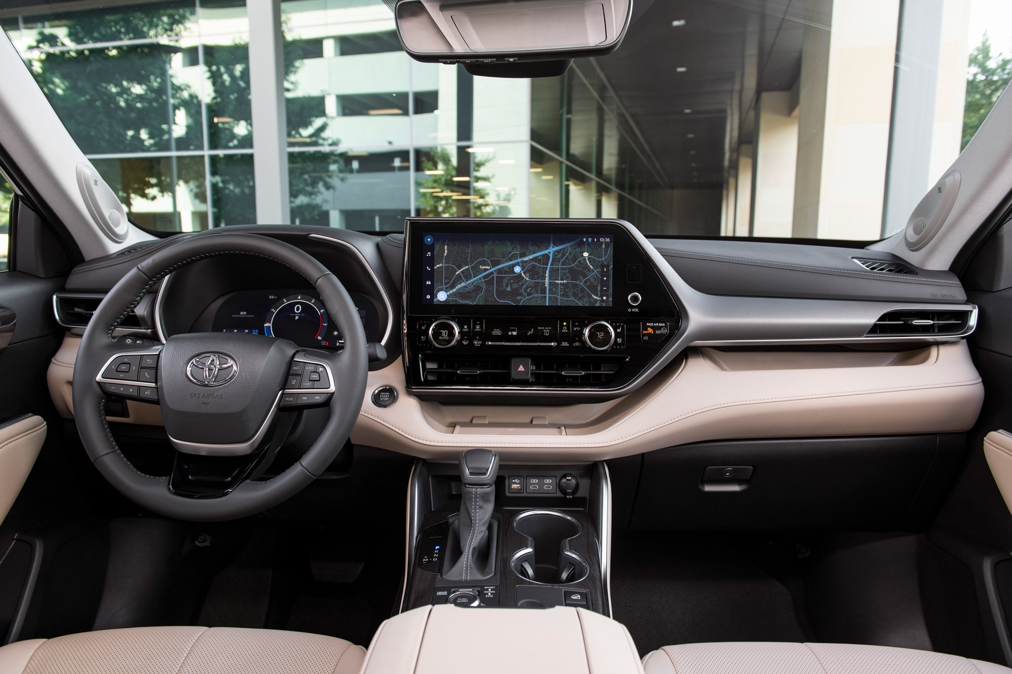 2024 Toyota Highlander interior and infotainment screen.