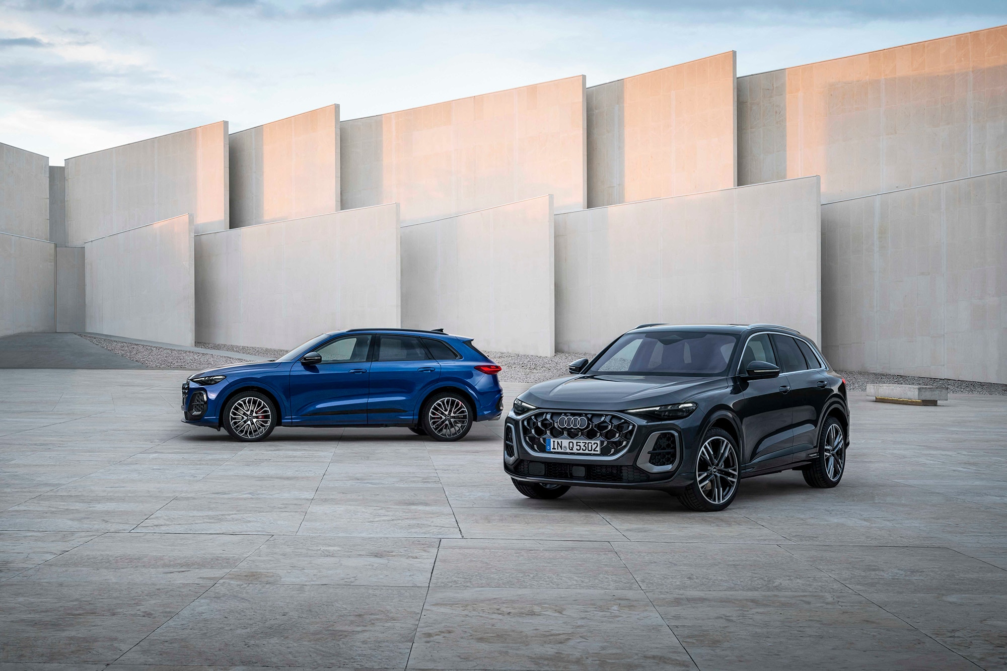 2025 Audi SQ5 in blue and 2025 Audi Q5 in dark gray