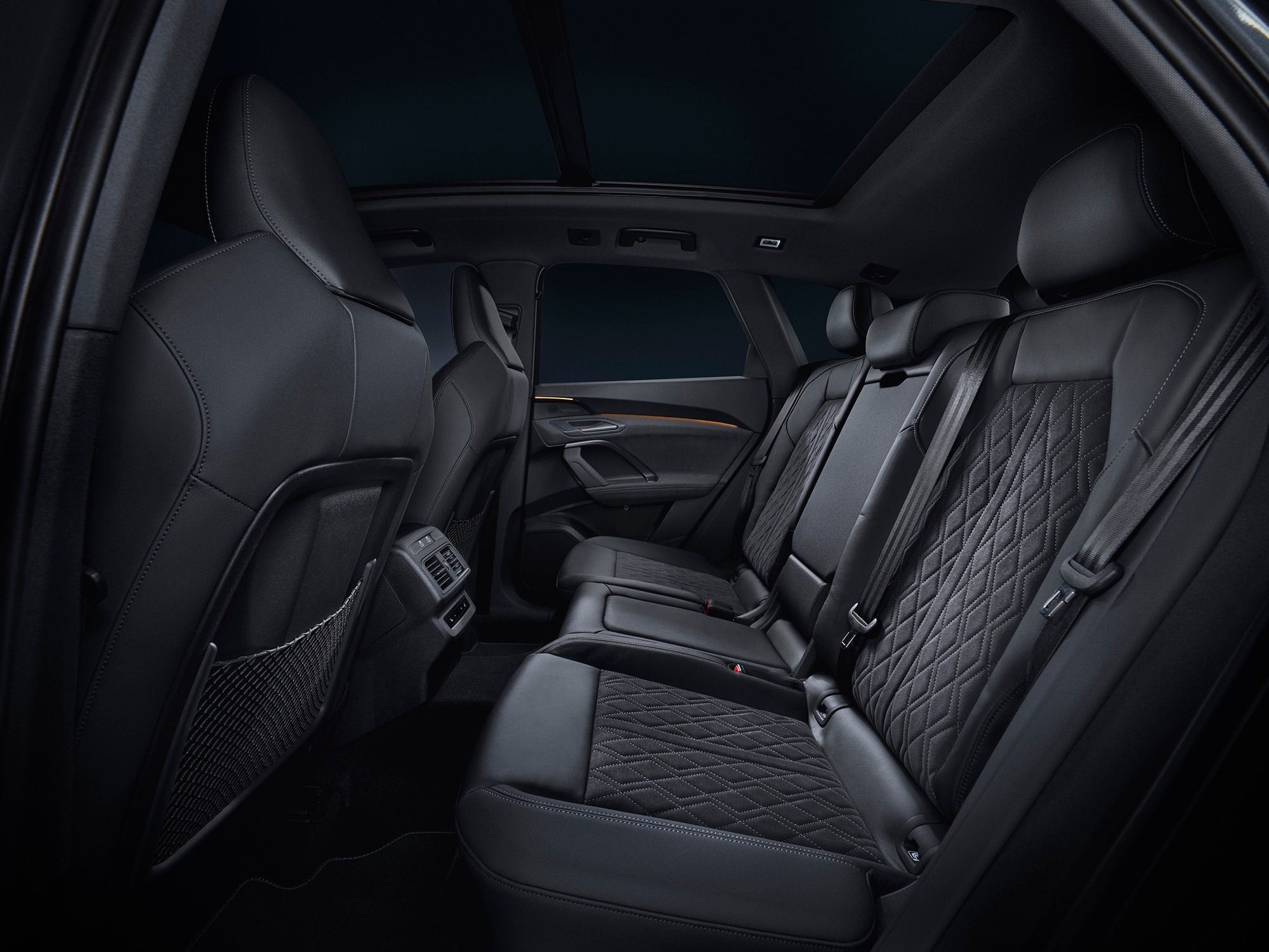 2025 Audi Q5 interior in black with back seats featuring quilted upholstery inserts