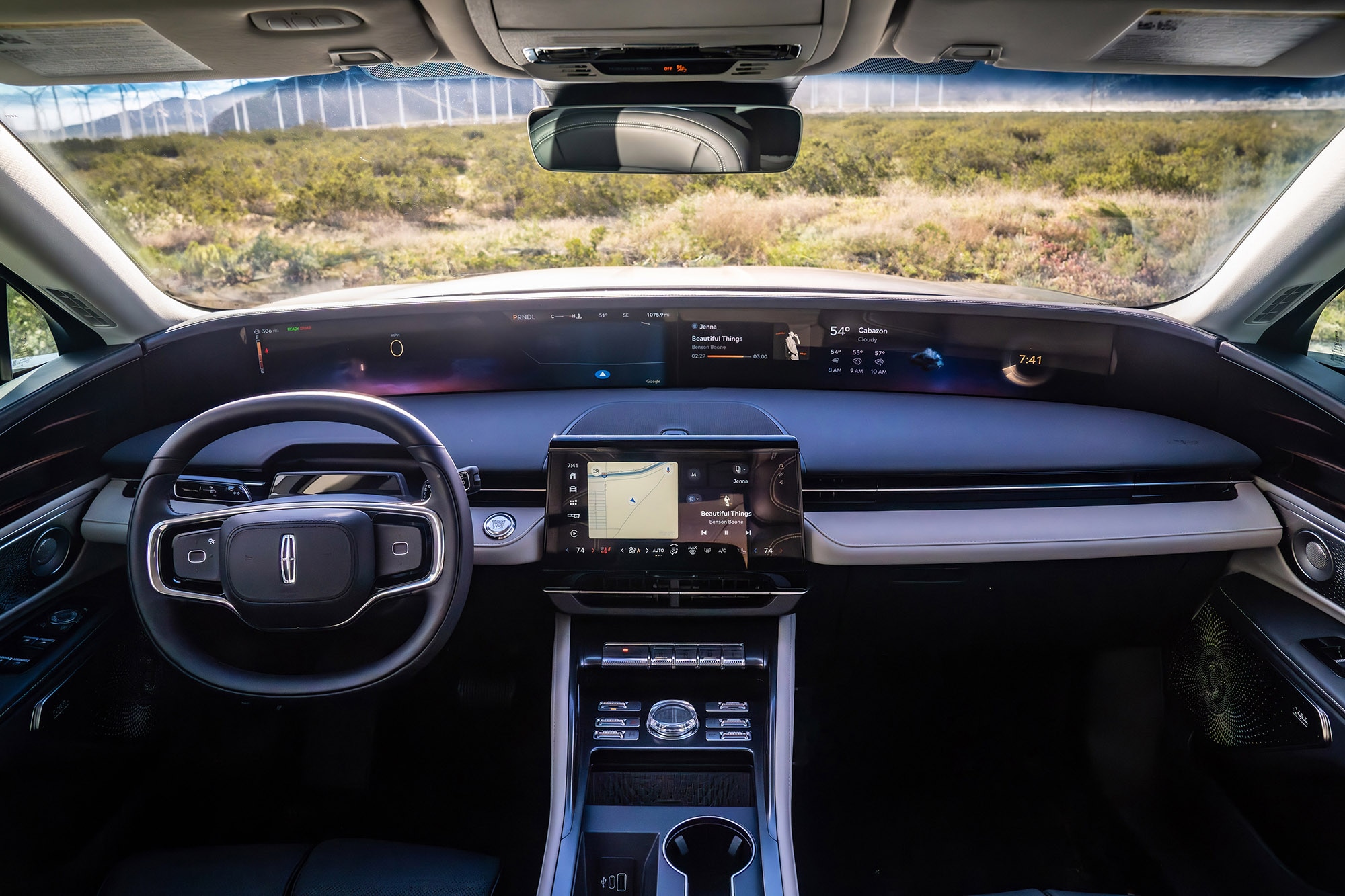 View of the steering wheel, dashboard, and infotainment screen in a Lincoln Nautilus.