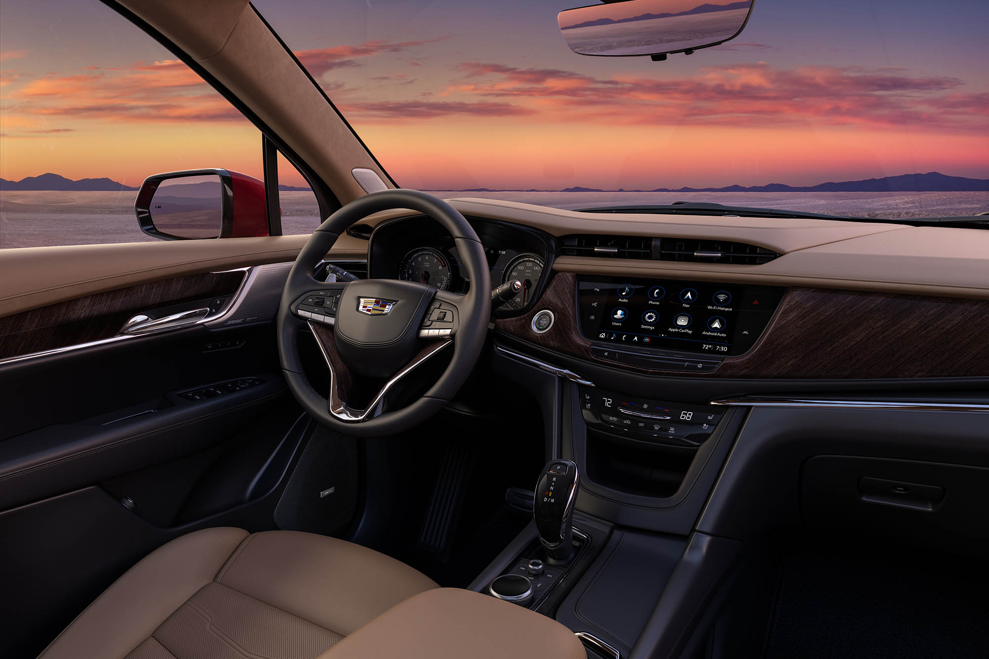 View of the steering wheel and infotainment screen in a Cadillac XT6.