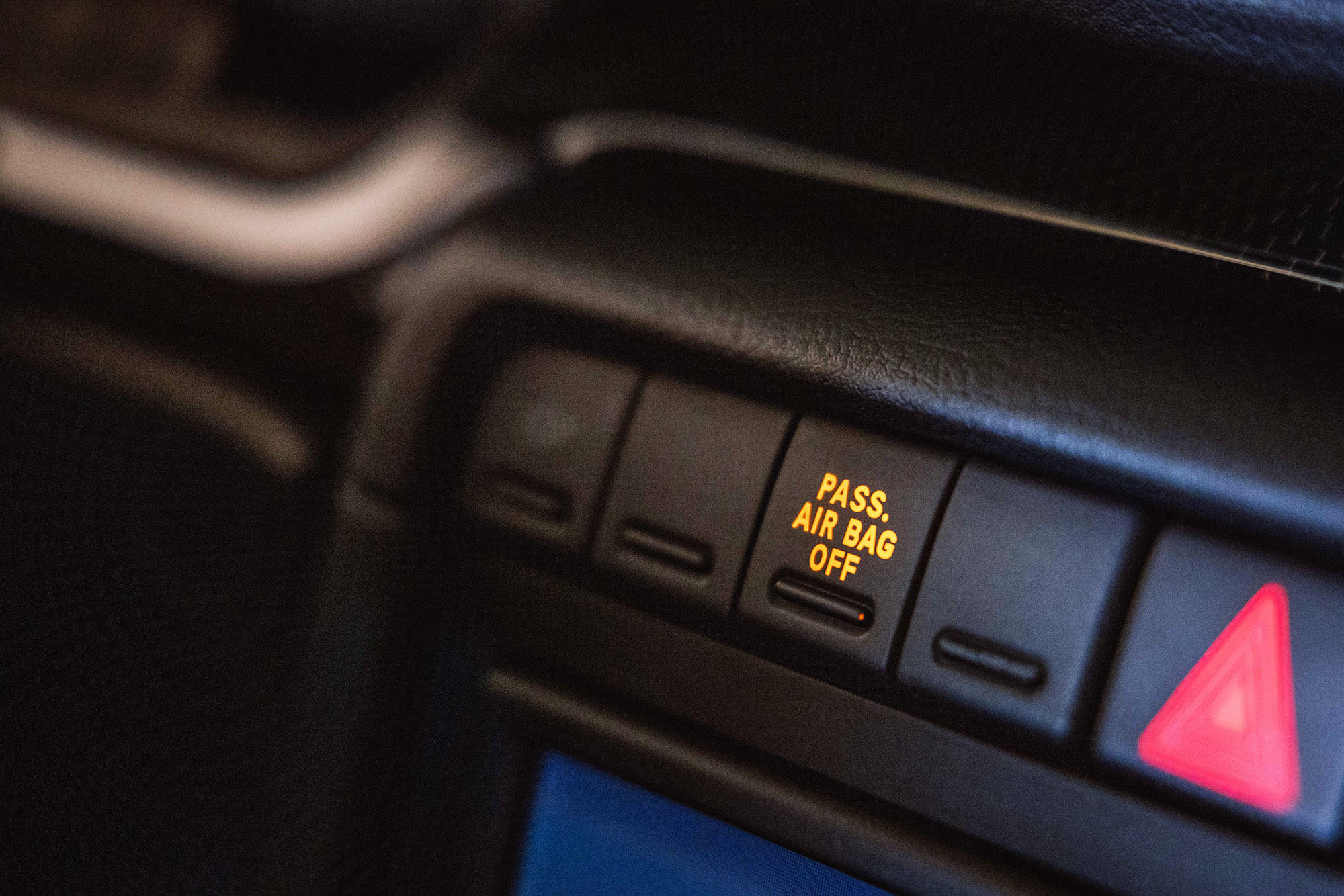 Center stack buttons in a vehicle interior with the words Pass. Air Bag Off illuminated.