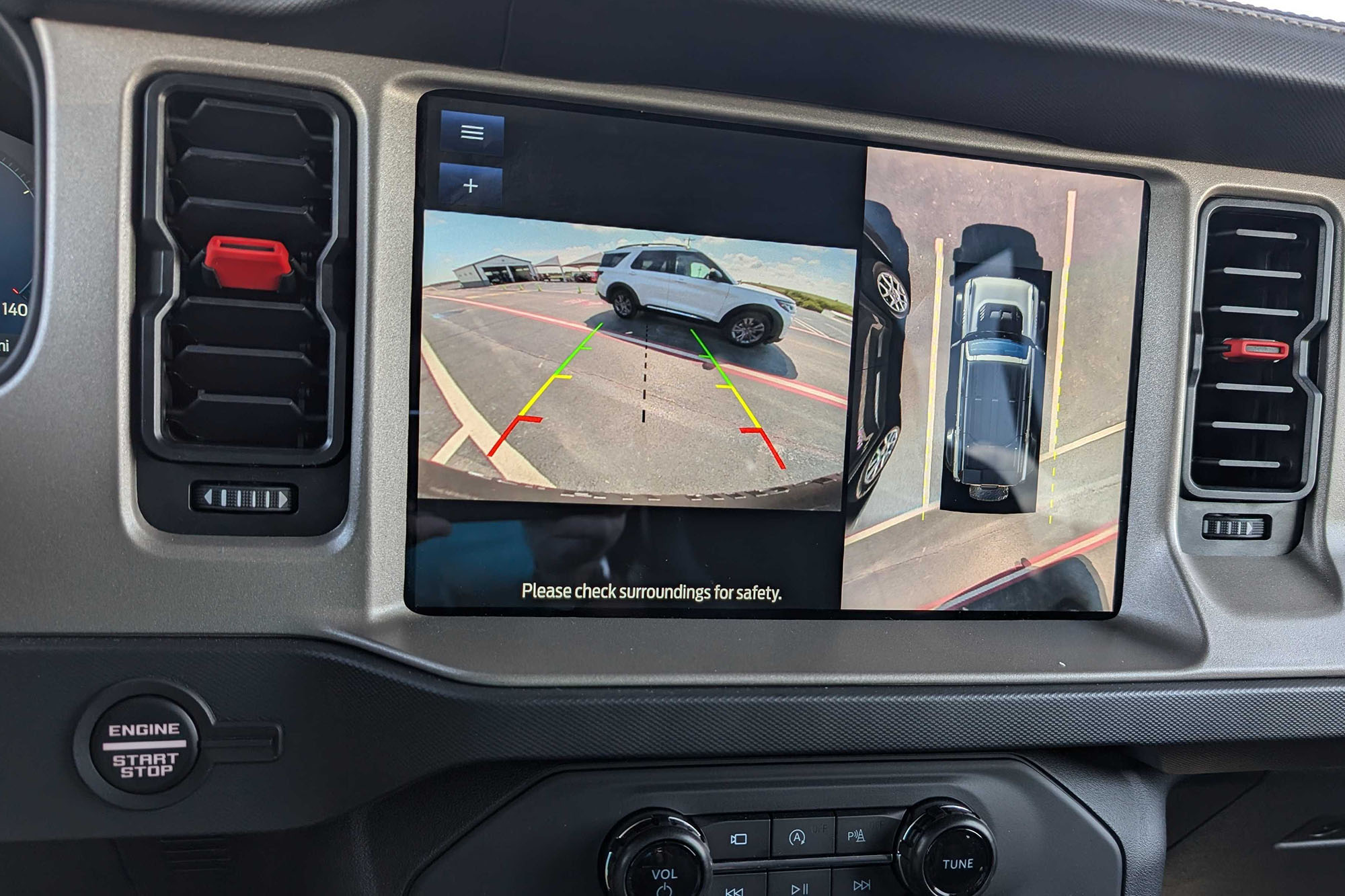 Rearview camera view in the infotainment screen of a vehicle.