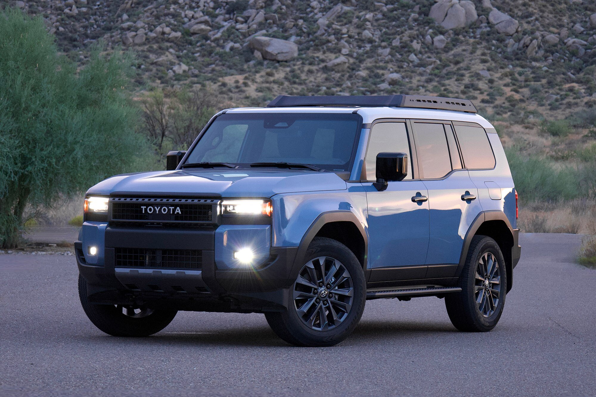 Front three-quarter view of a blue Toyota Land Cruiser.