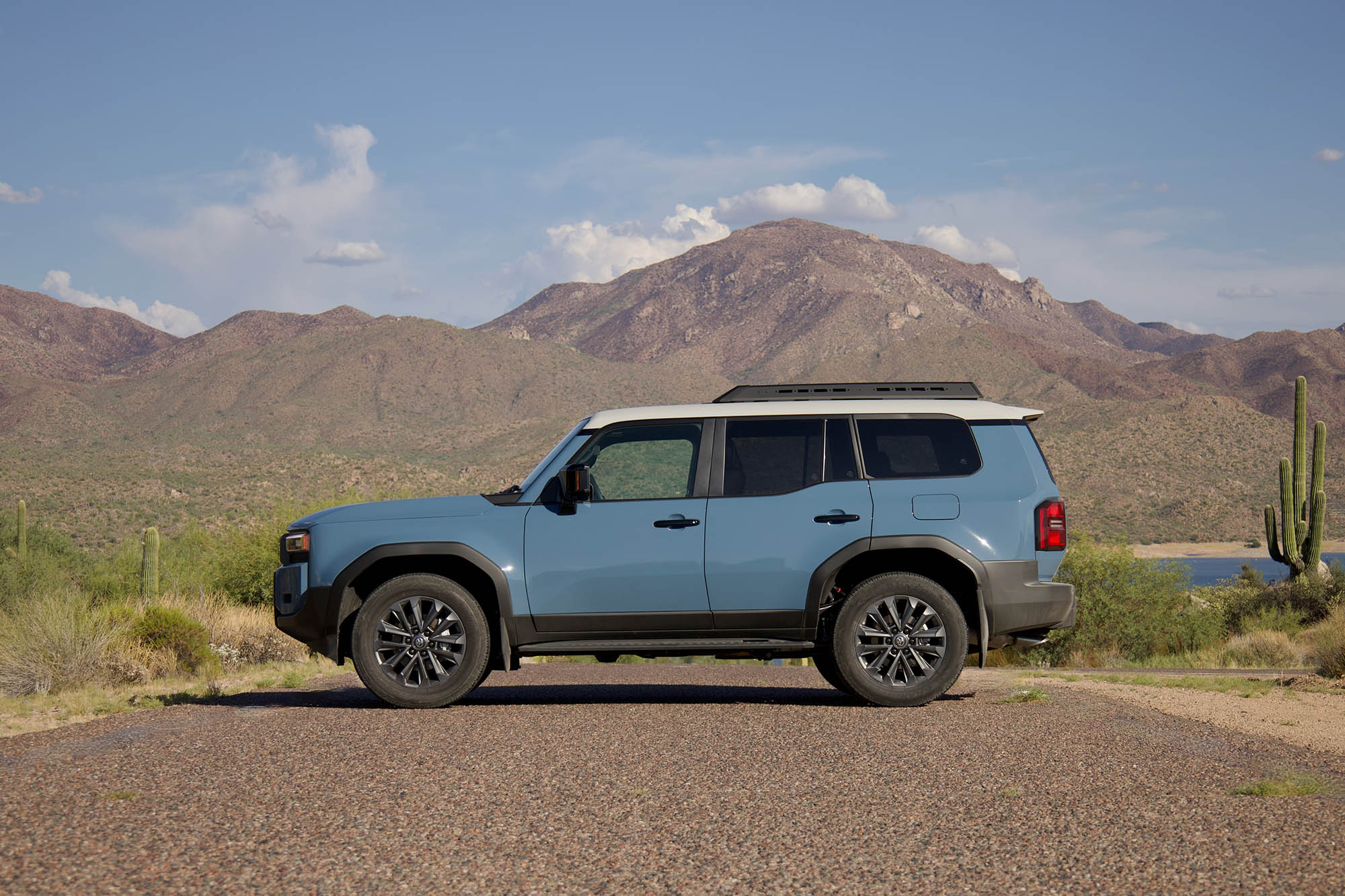 Side view of Toyota Land Cruiser in blue.