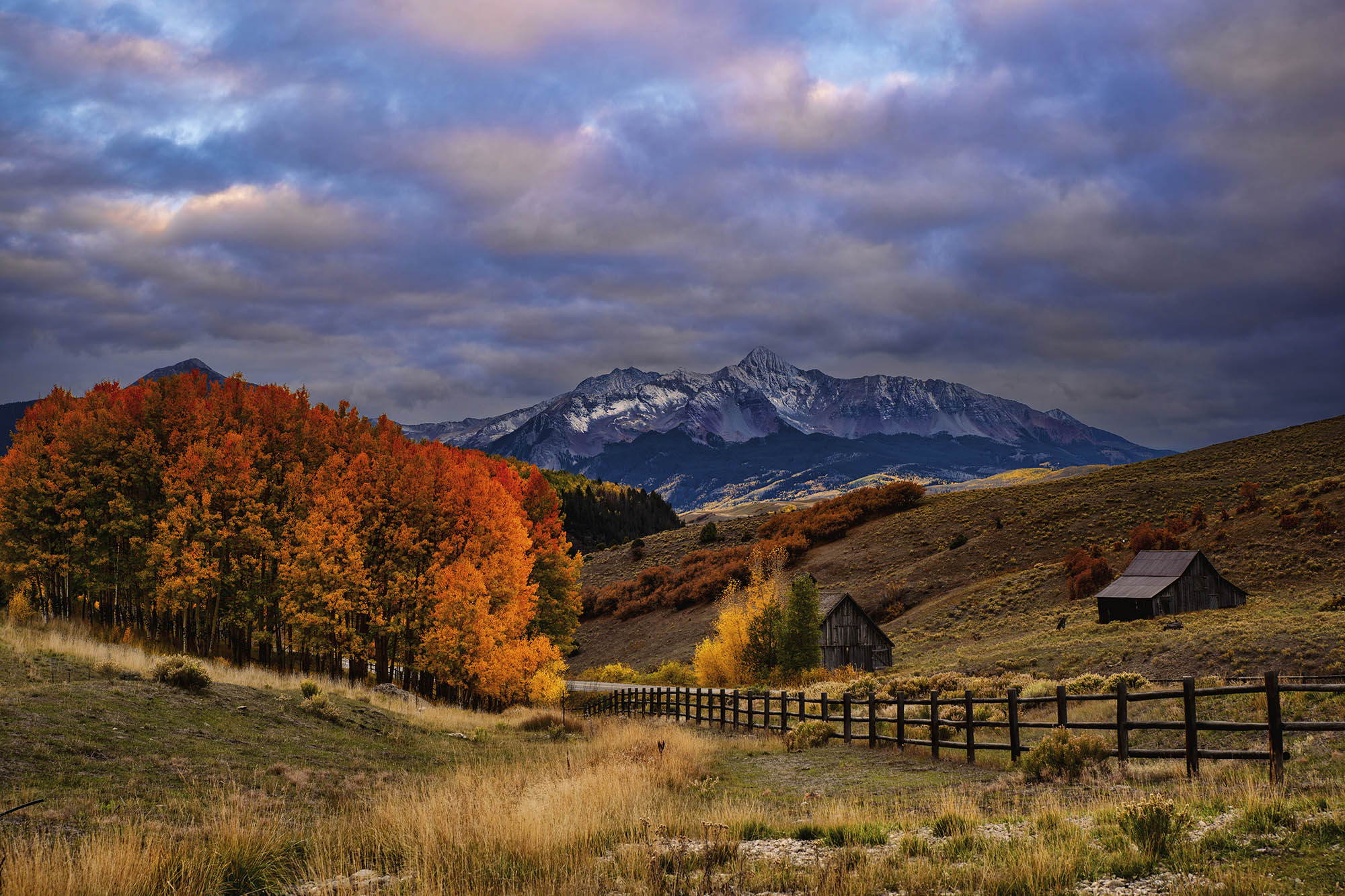 Mountains near Telluride Colorado with red and orange fall foliage in the foreground