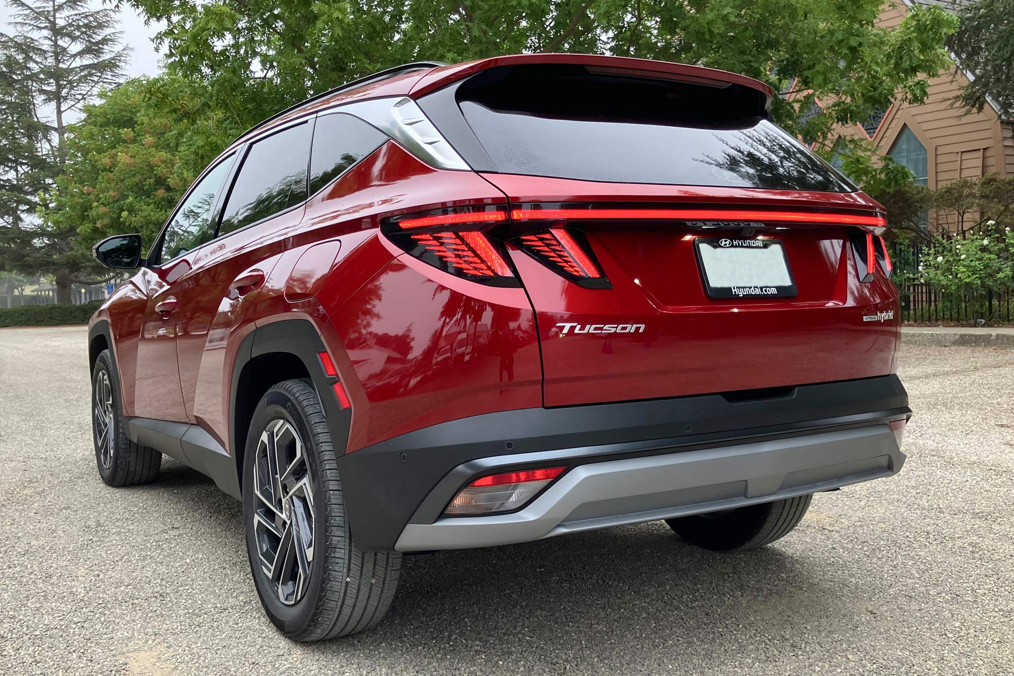 Rear of a 2025 Hyundai Tucson Hybrid Limited in Ultimate Red