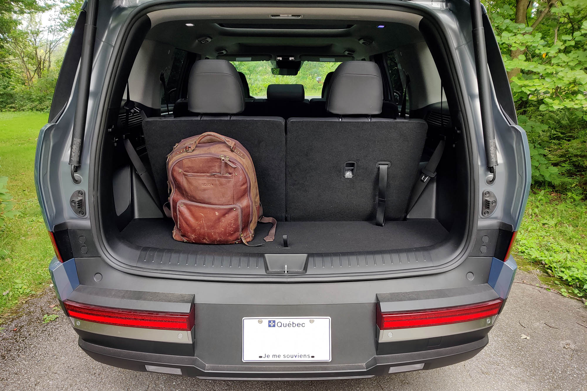 2024 Hyundai Santa Fe Hybrid cargo space behind the third-row seat, with backpack for scale