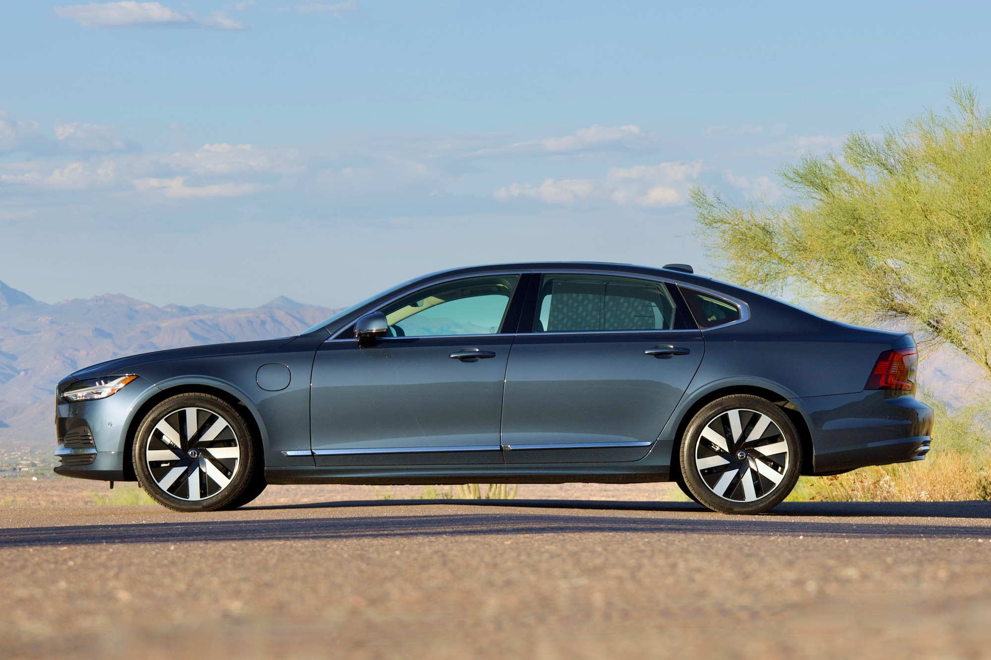 Side of a 2024 Volvo S90 T8 Recharge in Denim Blue