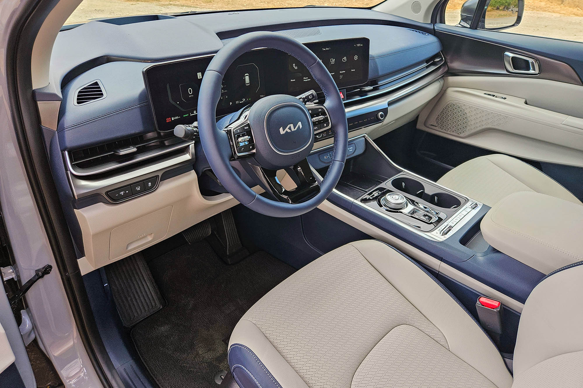 2025 Kia Carnival Hybrid SX Prestige interior showing the dashboard and front seats.