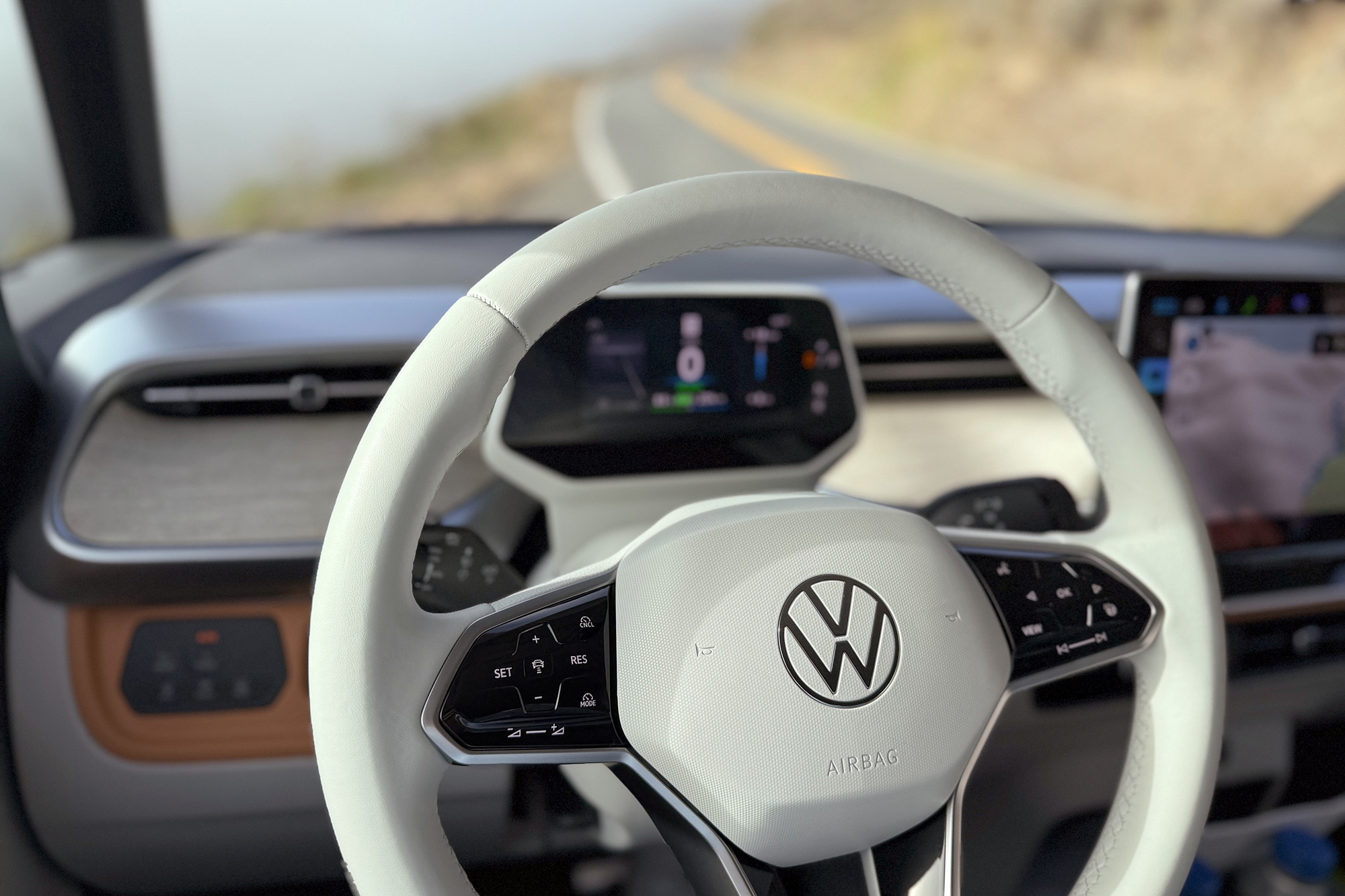 2025 Volkswagen ID. Buzz Pro S Plus interior showing the Travel Assist controls on the steering wheel.