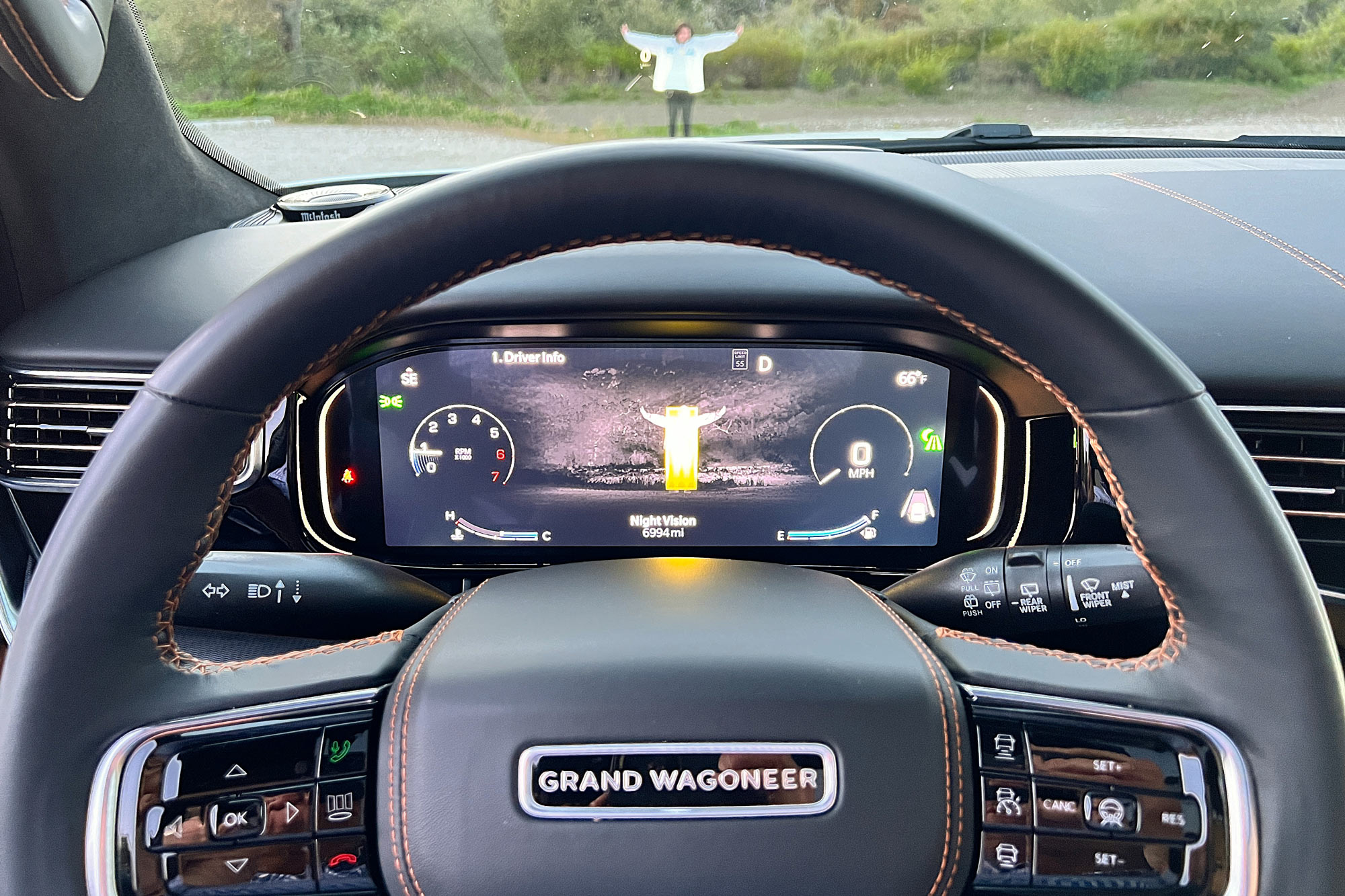 2024 Jeep Grand Wagoneer interior showing the available night vision system's display with a person in front of the SUV