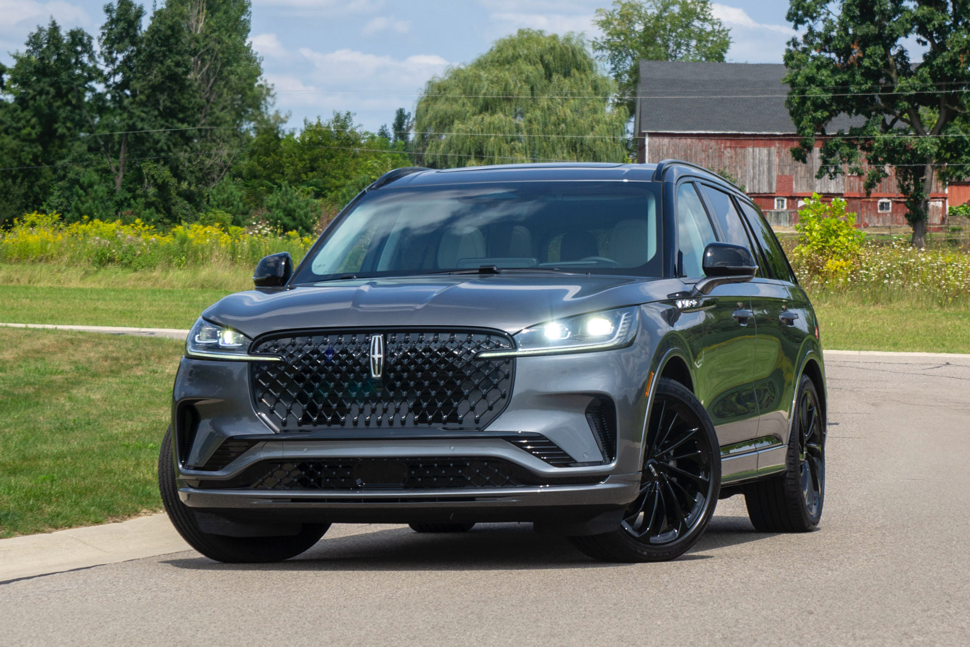 2025 Lincoln Aviator Reserve in Asher Gray with a field and a barn in the background