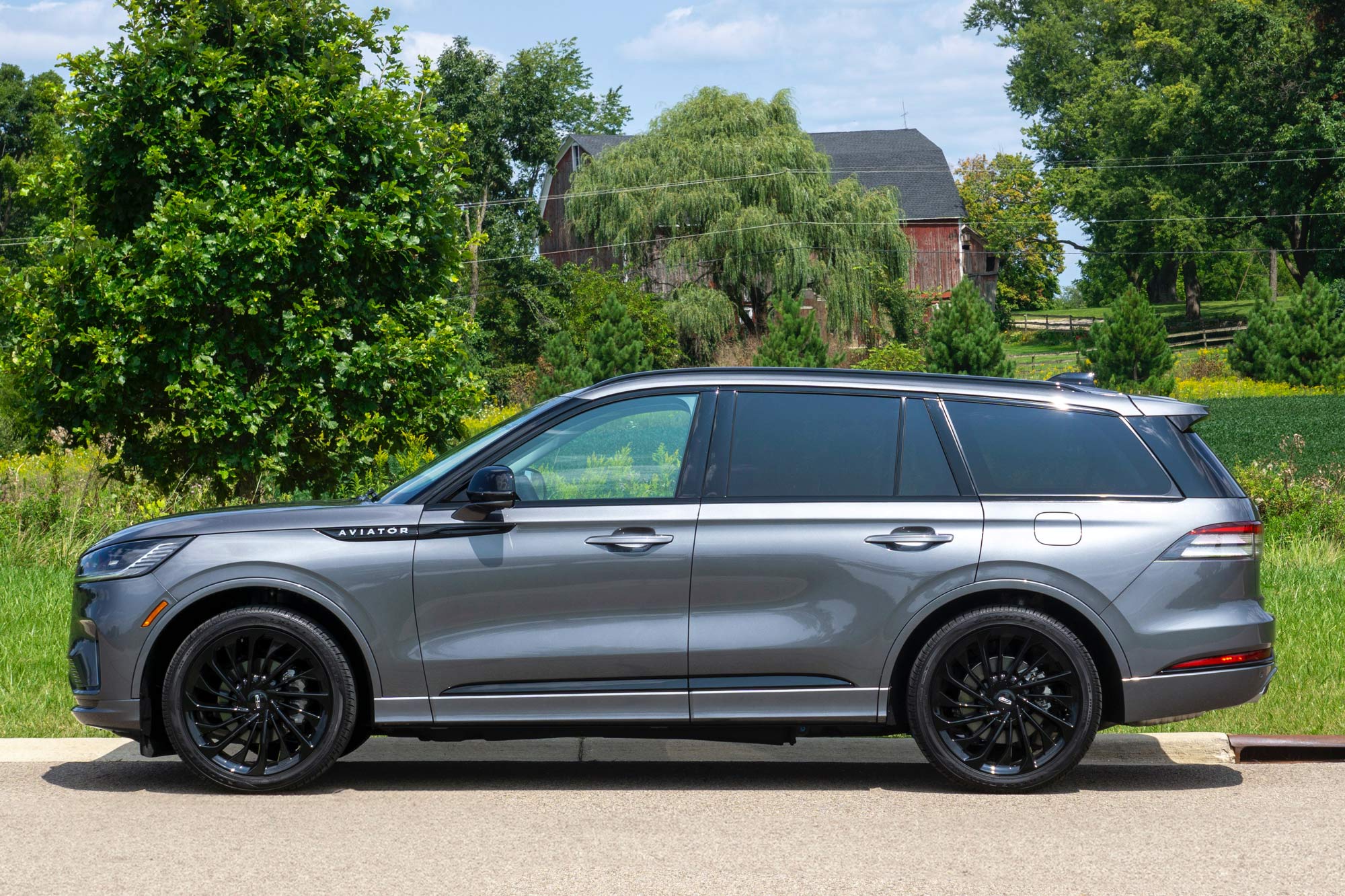 2025 Lincoln Aviator Reserve in Asher Gray with a field and a barn in the background